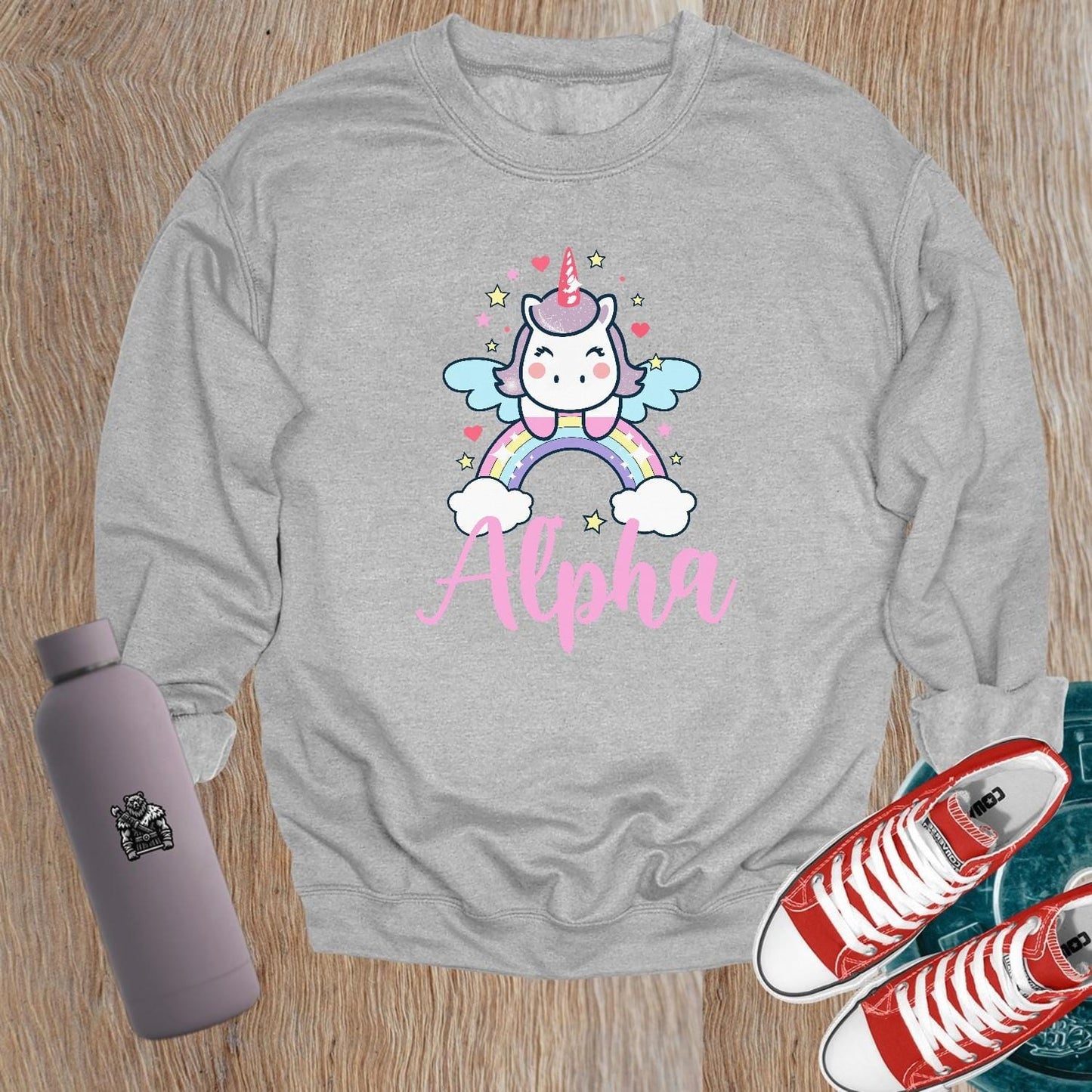 "Colorful Unicorn Alpha Sweatshirt with a playful unicorn soaring over a vibrant rainbow, designed for gym workouts and relaxation."