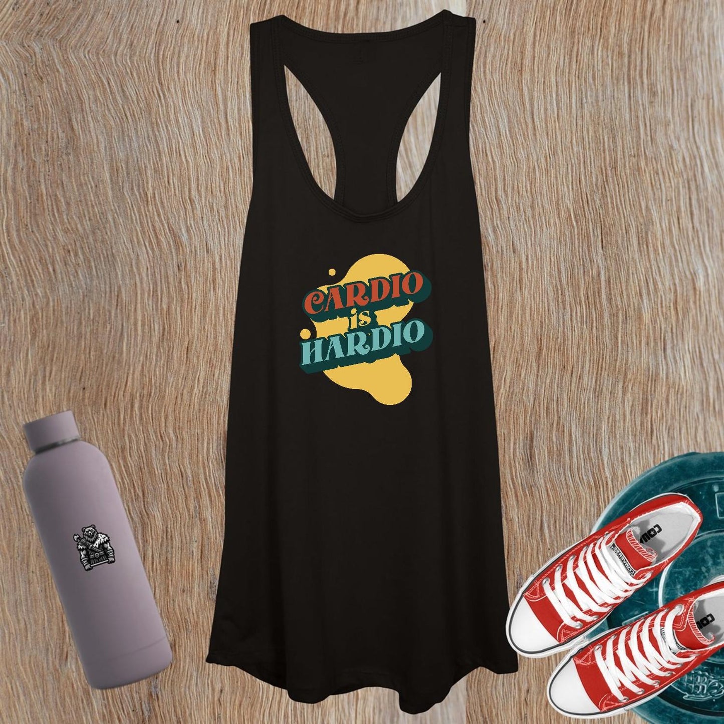 Alt text: "Women's tank top featuring a playful 'CARDIO is HARDIO' design, perfect for workouts and casual outings, showcasing a flattering fit."