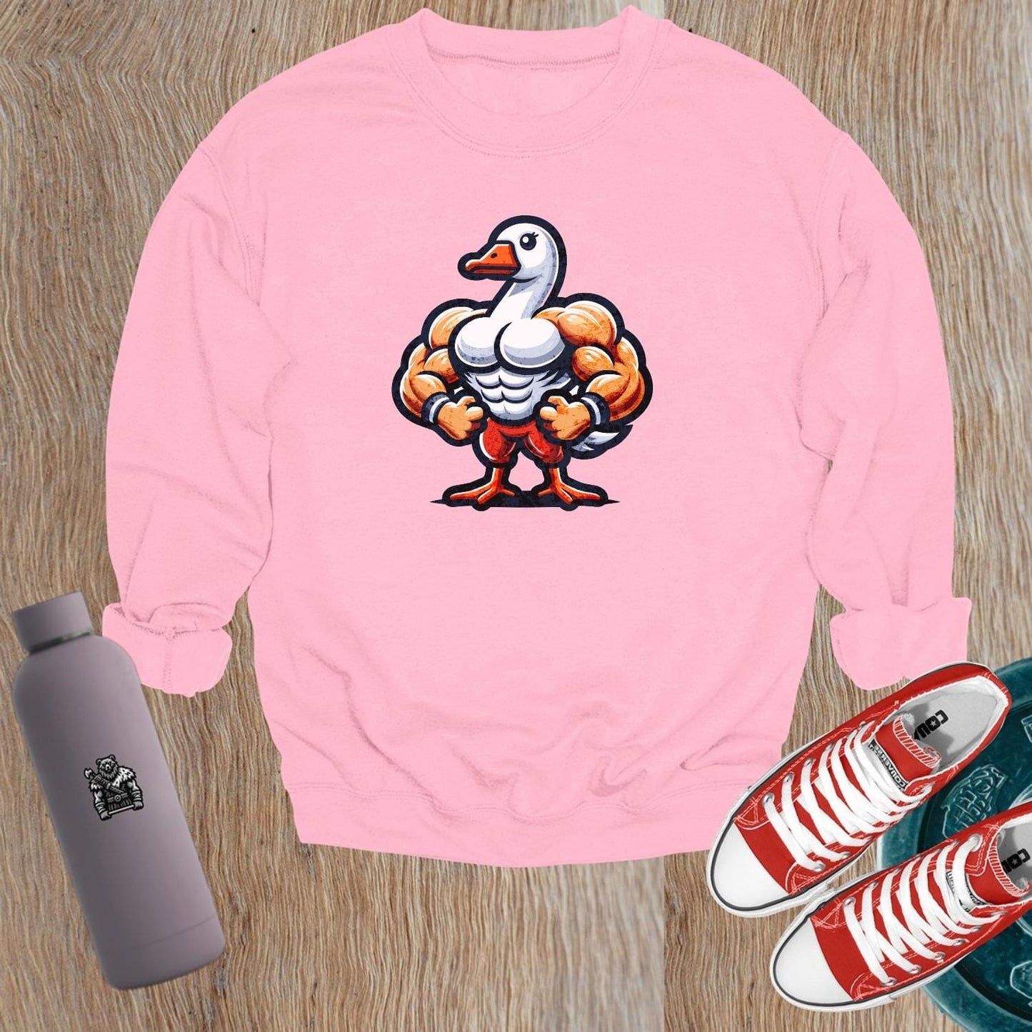 Alt text: "Bold graphic sweatshirt featuring a muscular goose, combining humor and motivation for fitness. Perfect for gym or casual wear."