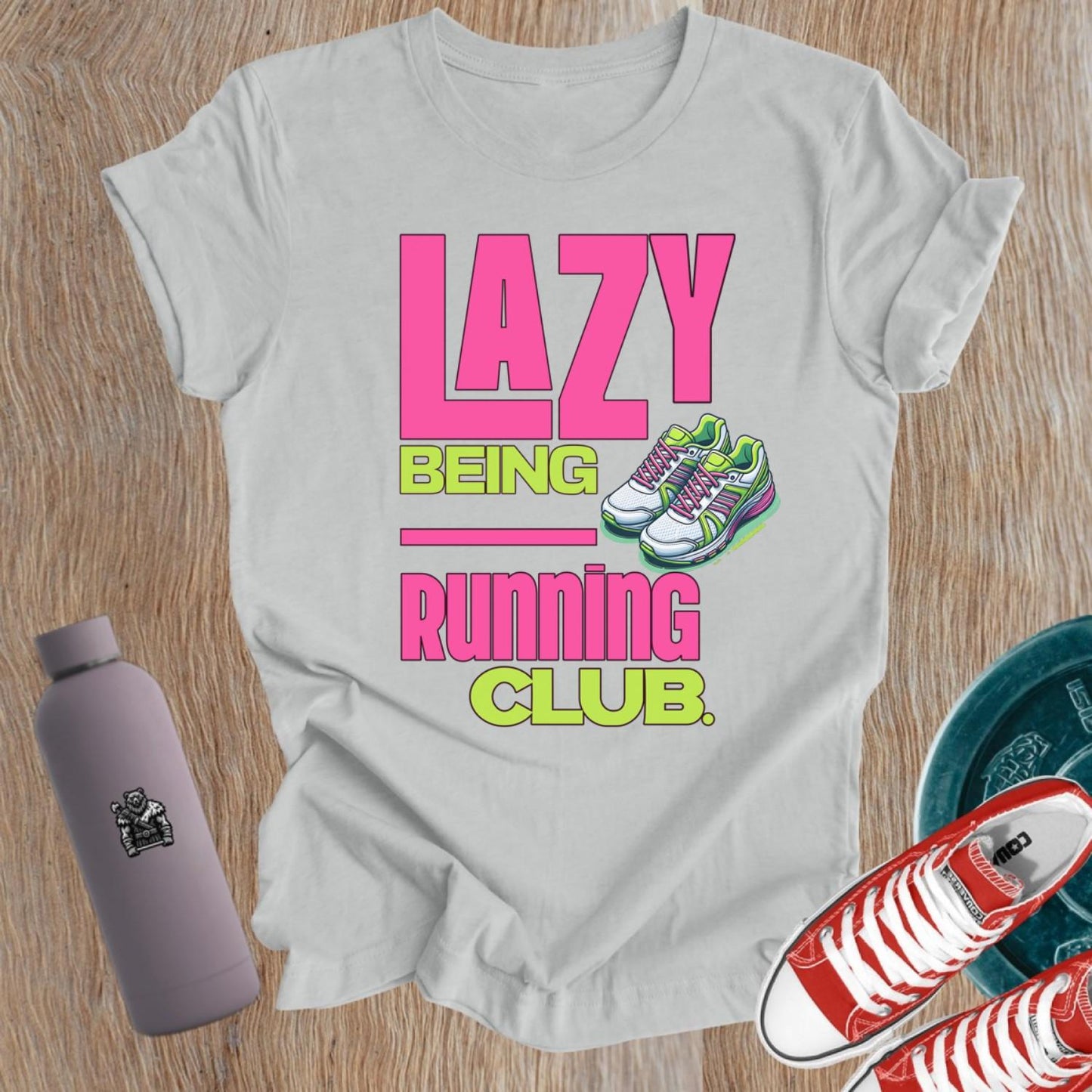 Alt text: "Fierce women's gym t-shirt featuring 'Lazy Being Running Club' bold graphic, perfect for lifting, workouts, and expressing strength."