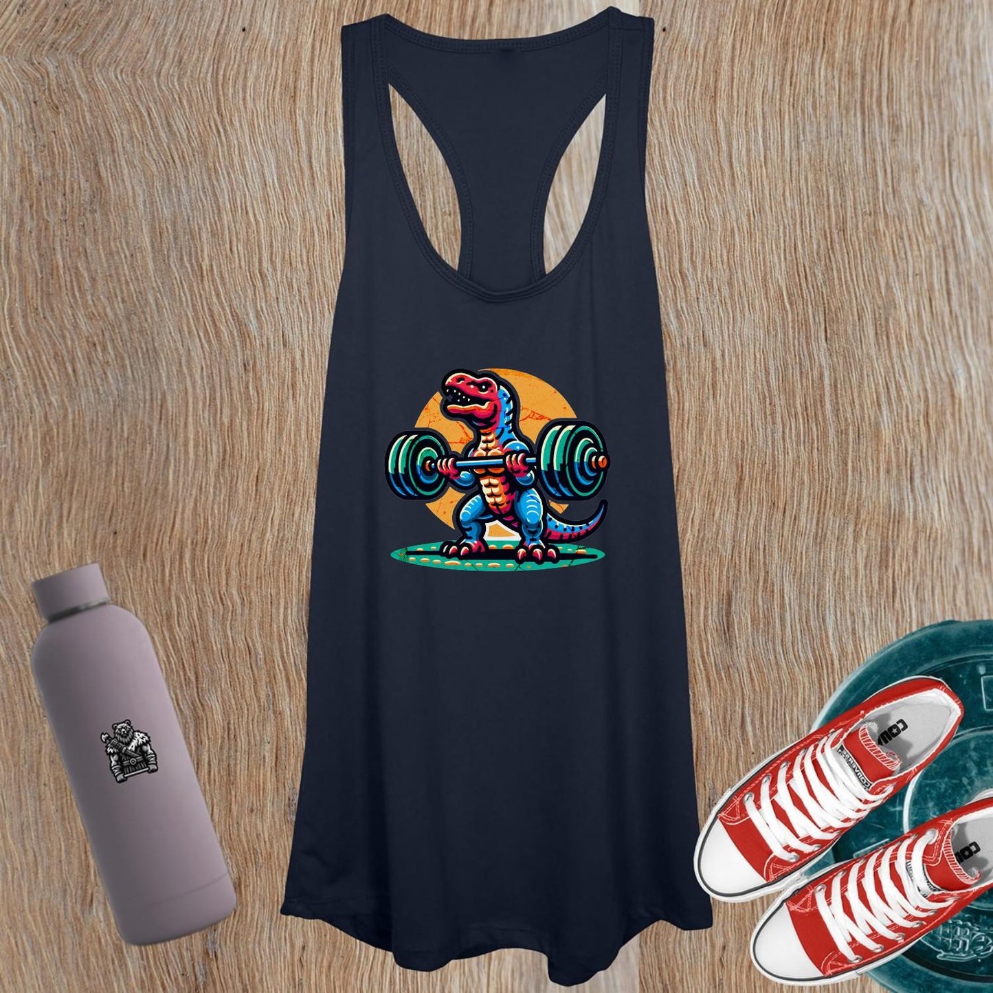 "Vibrant women's tank top featuring a playful dinosaur lifting weights, perfect for gym sessions and casual outings, promoting strength."