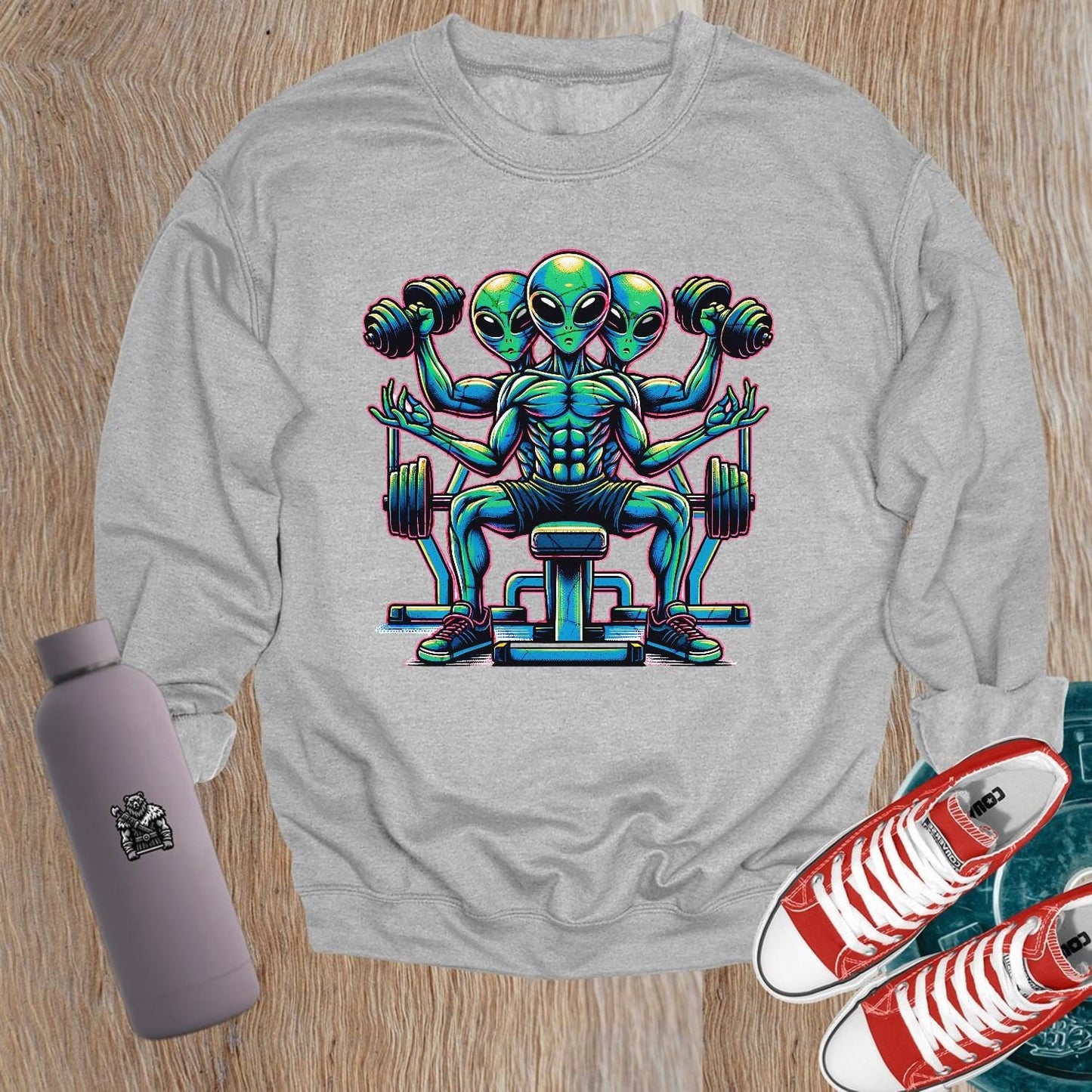 "Vibrant gym sweatshirt featuring a bold alien lifter graphic, perfect for fitness enthusiasts. Energetic design for workouts and casual wear."