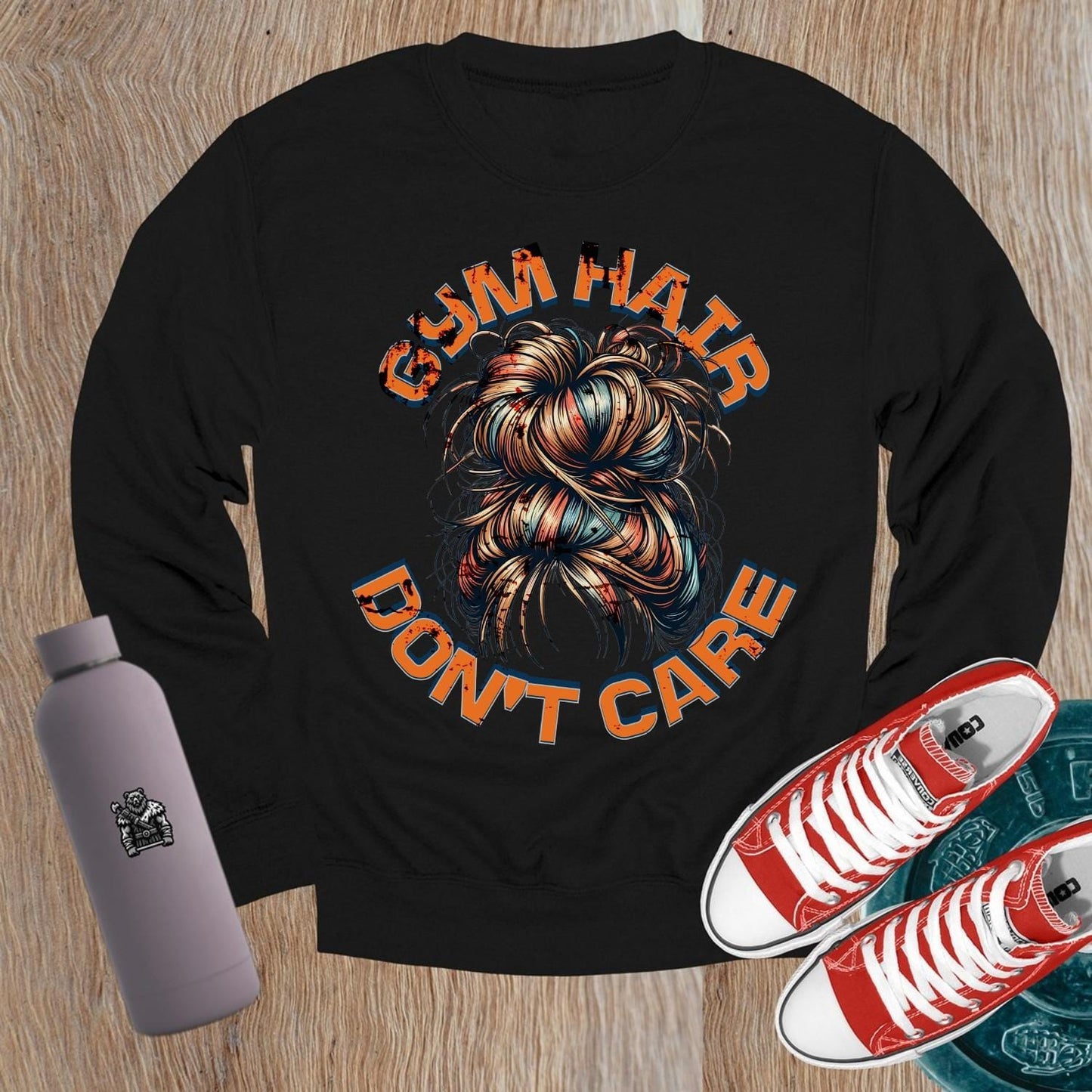 Alt text: "Vibrant crewneck sweatshirt featuring bold 'Gym Hair Don't Care' graphic, ideal for workouts or lounging, showcasing fitness flair."