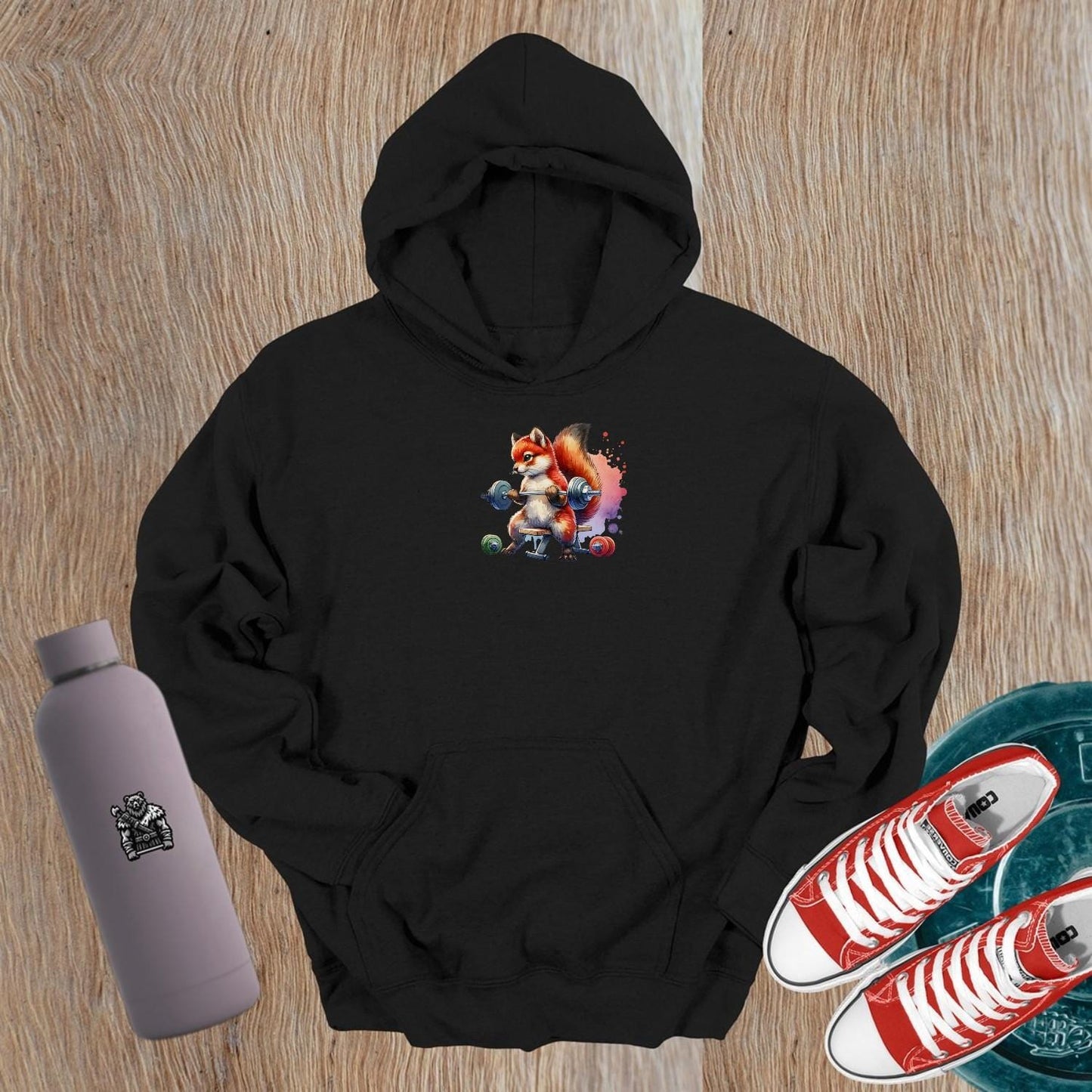"Eye-catching gym hoodie featuring a playful fox lifting weights, blending style and motivation for fitness enthusiasts. Perfect for workouts!"