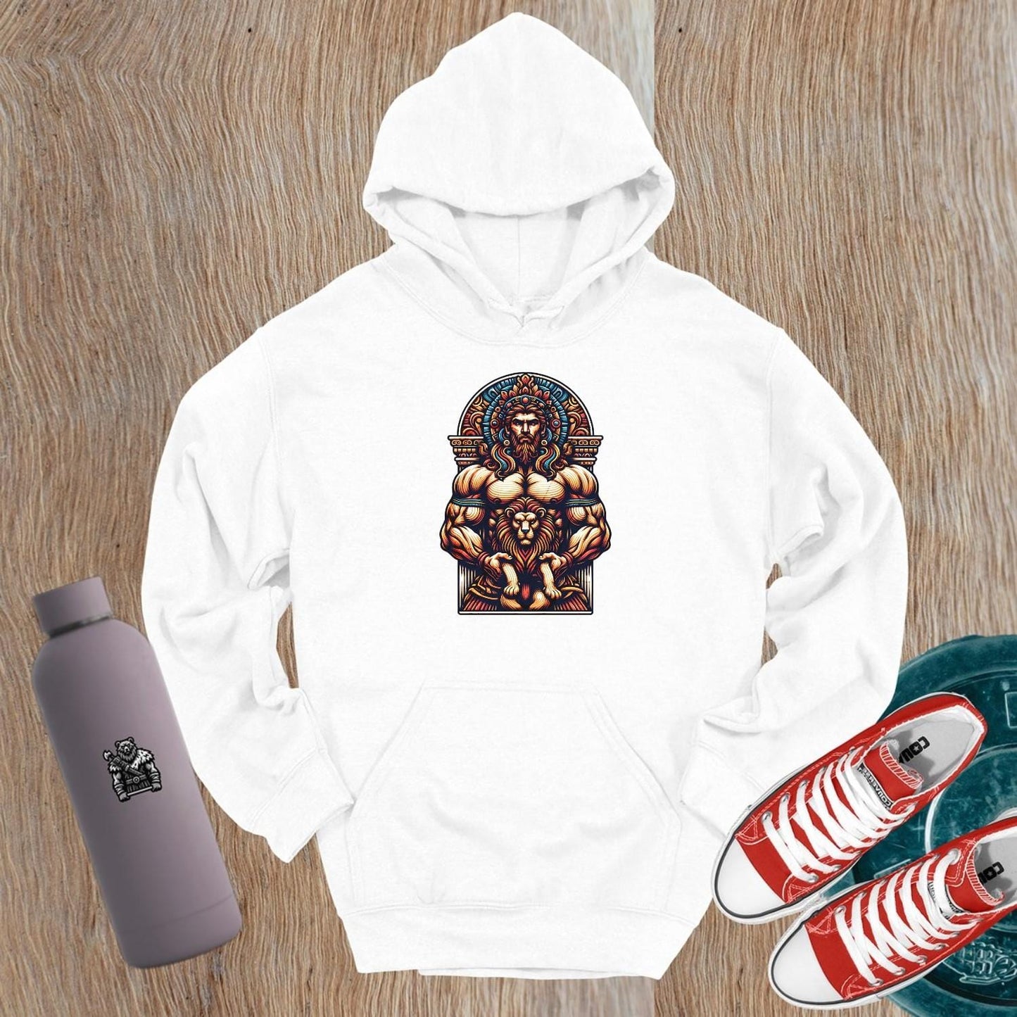 "Graphic gym hoodie featuring a muscular figure and fierce lion design, symbolizing strength, courage, and resilience for workout wear."