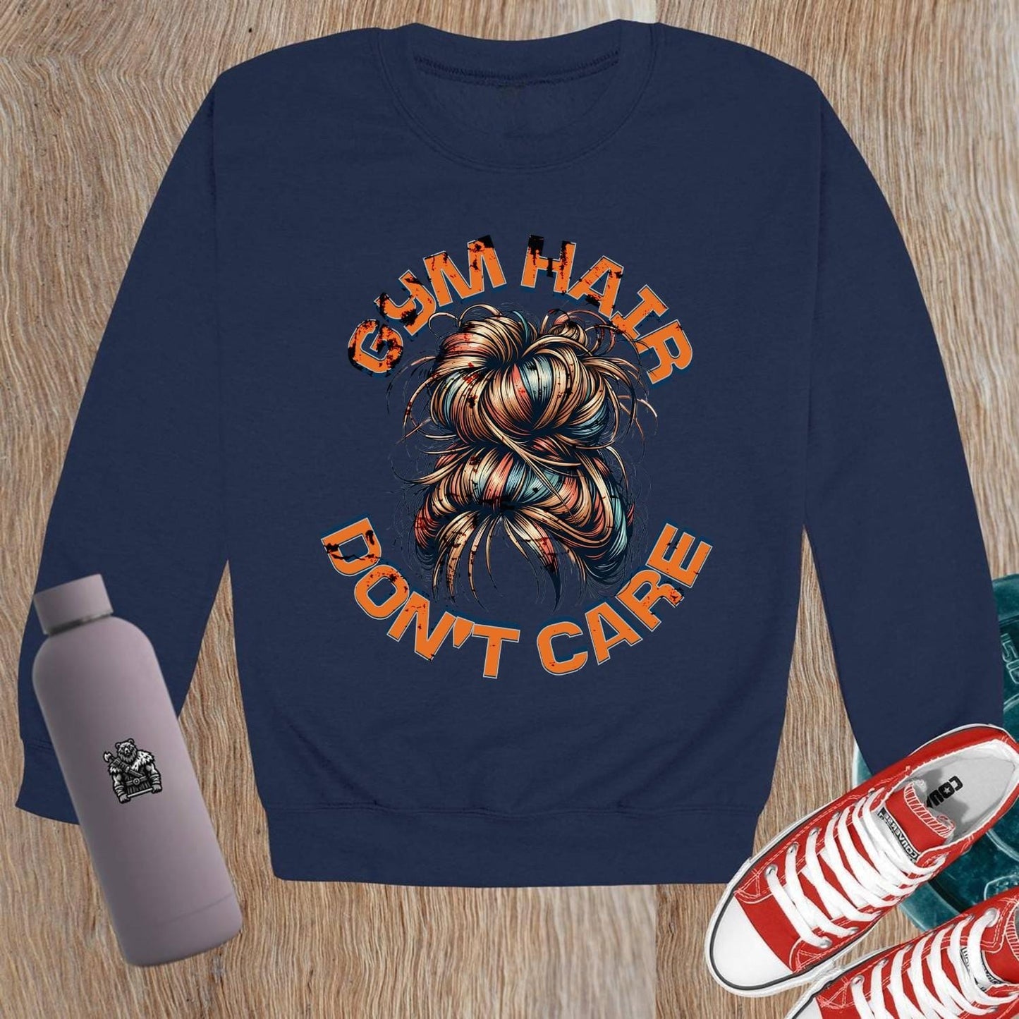 Alt text: "Vibrant crewneck sweatshirt featuring bold 'Gym Hair Don't Care' graphic, ideal for workouts or lounging, showcasing fitness flair."