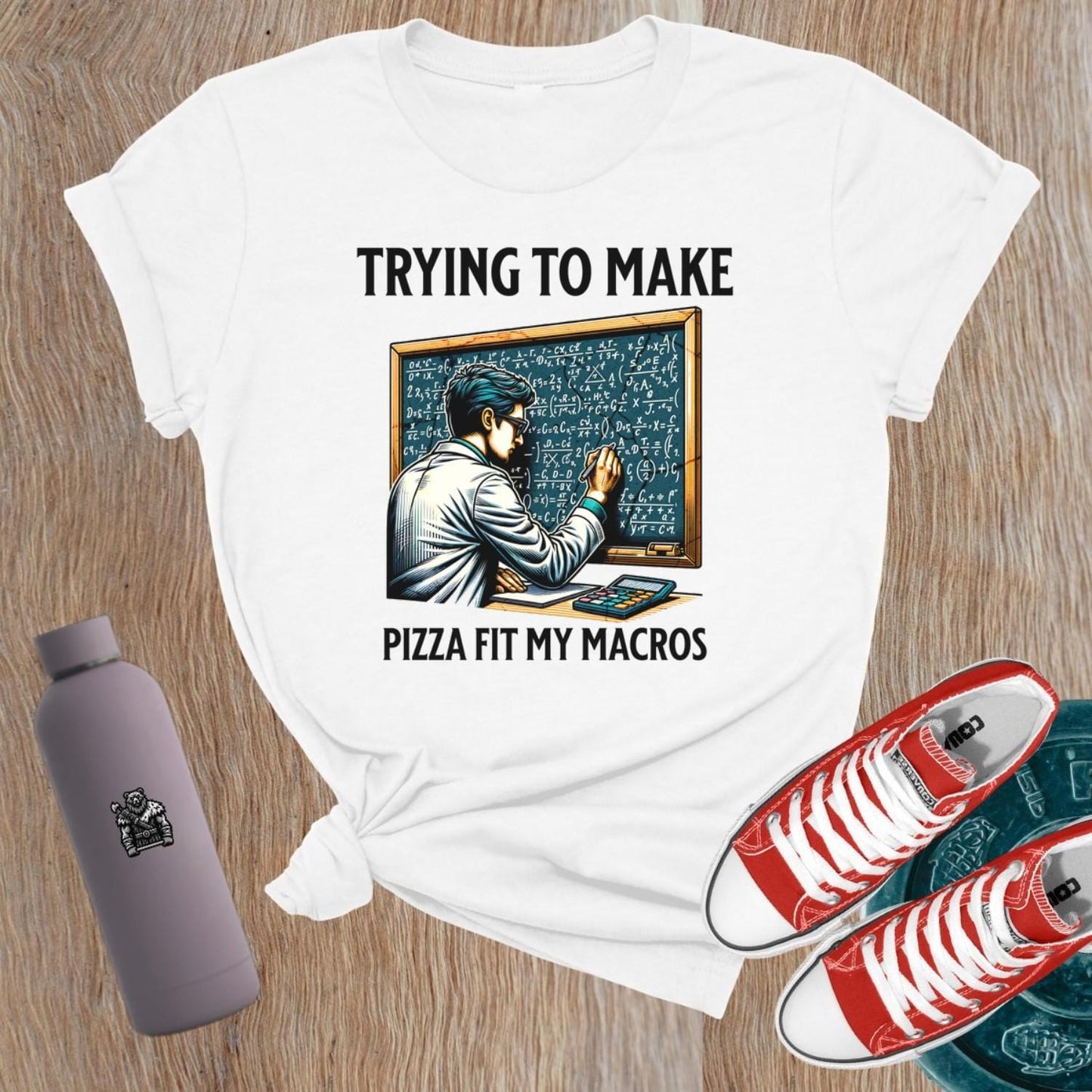 Alt text: "A humorous women’s fitness T-shirt featuring the phrase 'Trying to Make Pizza Fit My Macros'. Ideal for gym lovers, this playful design combines strength and balance, perfect for those who lift. Showcases a vibrant graphic, inspiring fitness journeys and conversations at the gym."