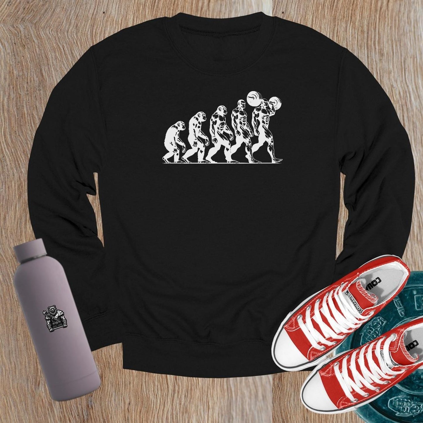 "Graphic gym crewneck sweatshirt featuring bold 'Evolution' design, perfect for fitness enthusiasts to showcase strength and transformation."