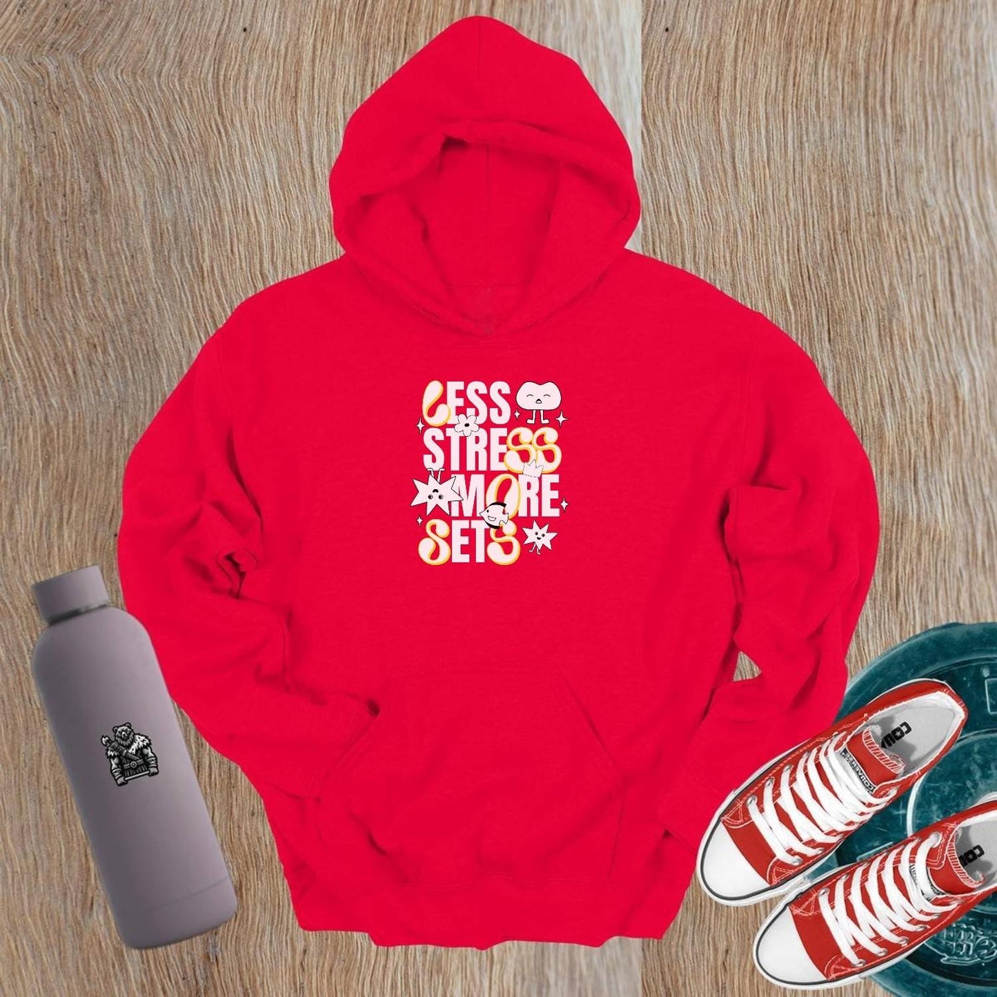 Vibrant gym hoodie featuring "Less Stress, More Sets!" motivational mantra, perfect for workouts and casual wear, embracing fitness fun.