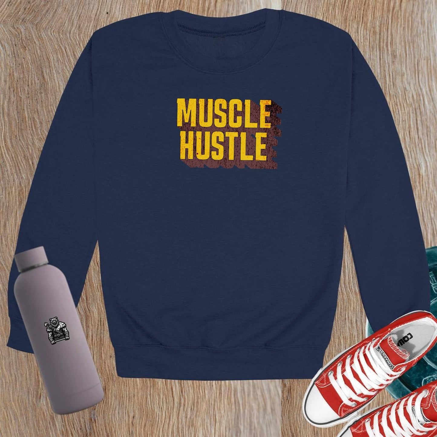 "Muscle Hustle crewneck sweatshirt for workouts, featuring bold design and comfortable fit, perfect for the gym or casual wear."