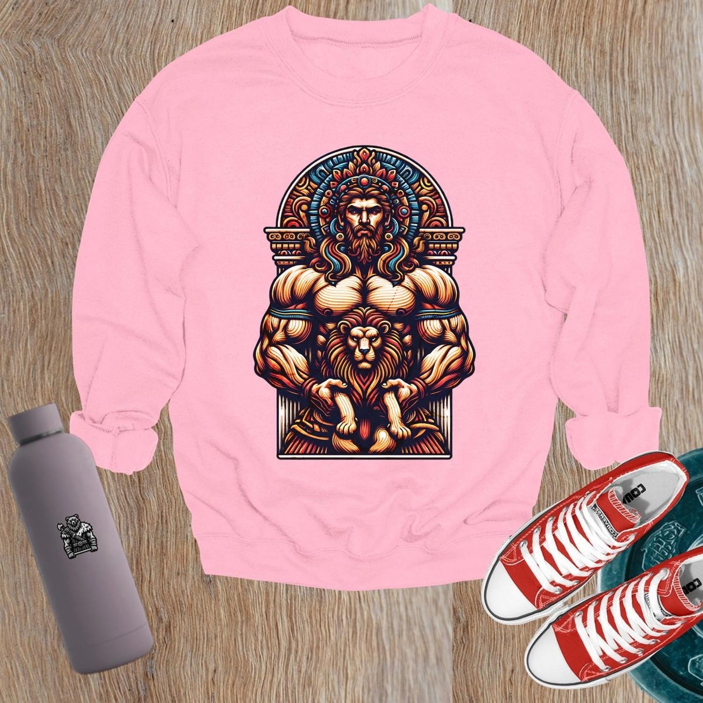 "Bold graphic sweatshirt featuring muscular figure and lion design, symbolizing strength, resilience, and courage for gym enthusiasts."