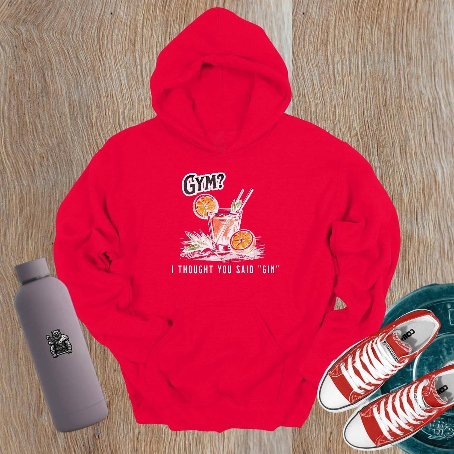 Graphic gym hoodie featuring the slogan "Gym? I thought you said 'gin.'" in playful font, perfect for fitness lovers and casual wear.