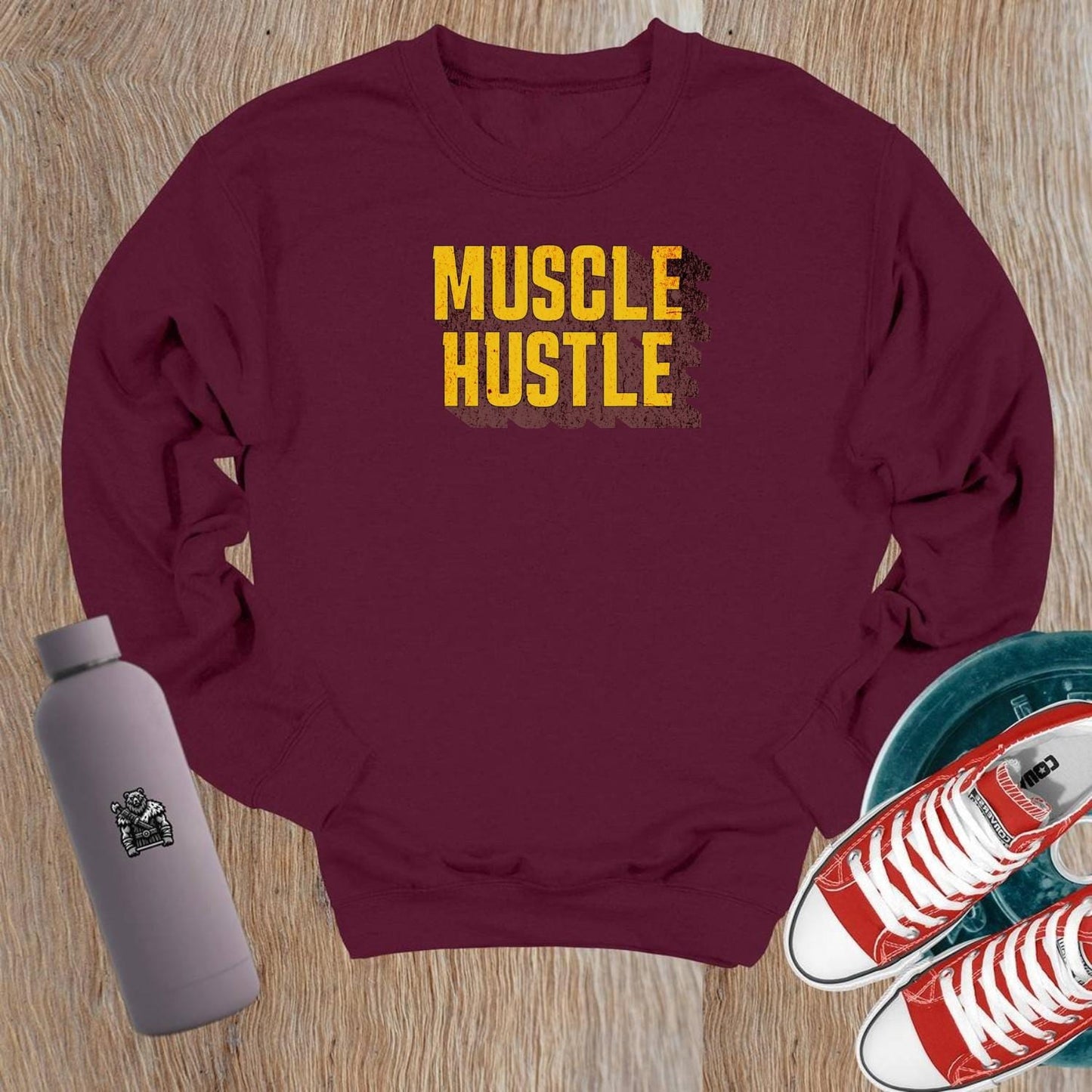 "Muscle Hustle crewneck sweatshirt for workouts, featuring bold design and comfortable fit, perfect for the gym or casual wear."