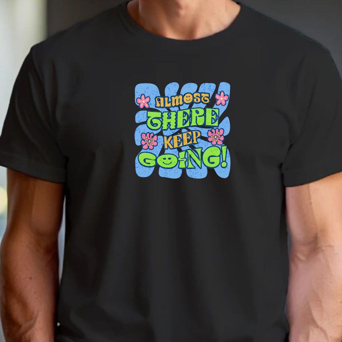"Vibrant 'Almost There, Keep Going!' graphic gym T-shirt, featuring motivational design for fitness enthusiasts to inspire perseverance."