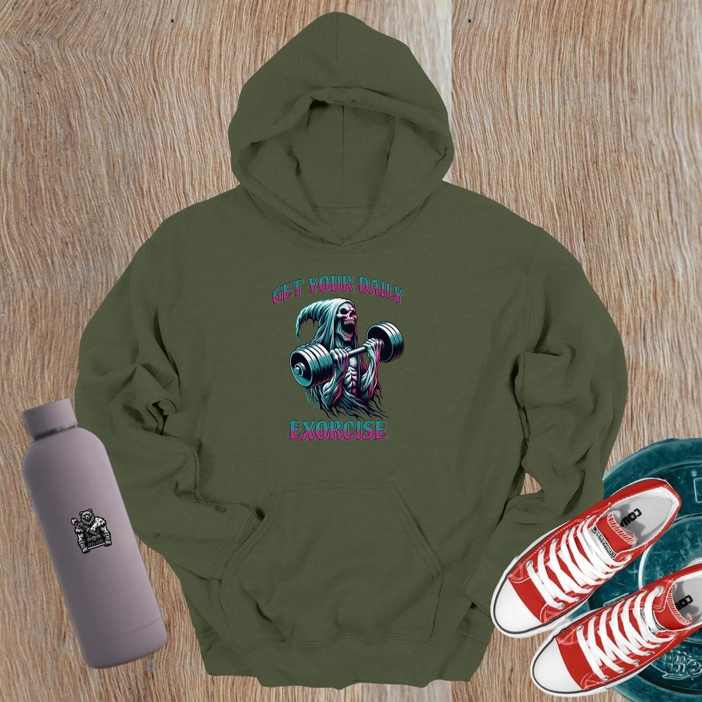 Alt text: "Striking graphic of a fierce skeleton lifting weights on a black hoodie, perfect for gym enthusiasts seeking motivation and style."