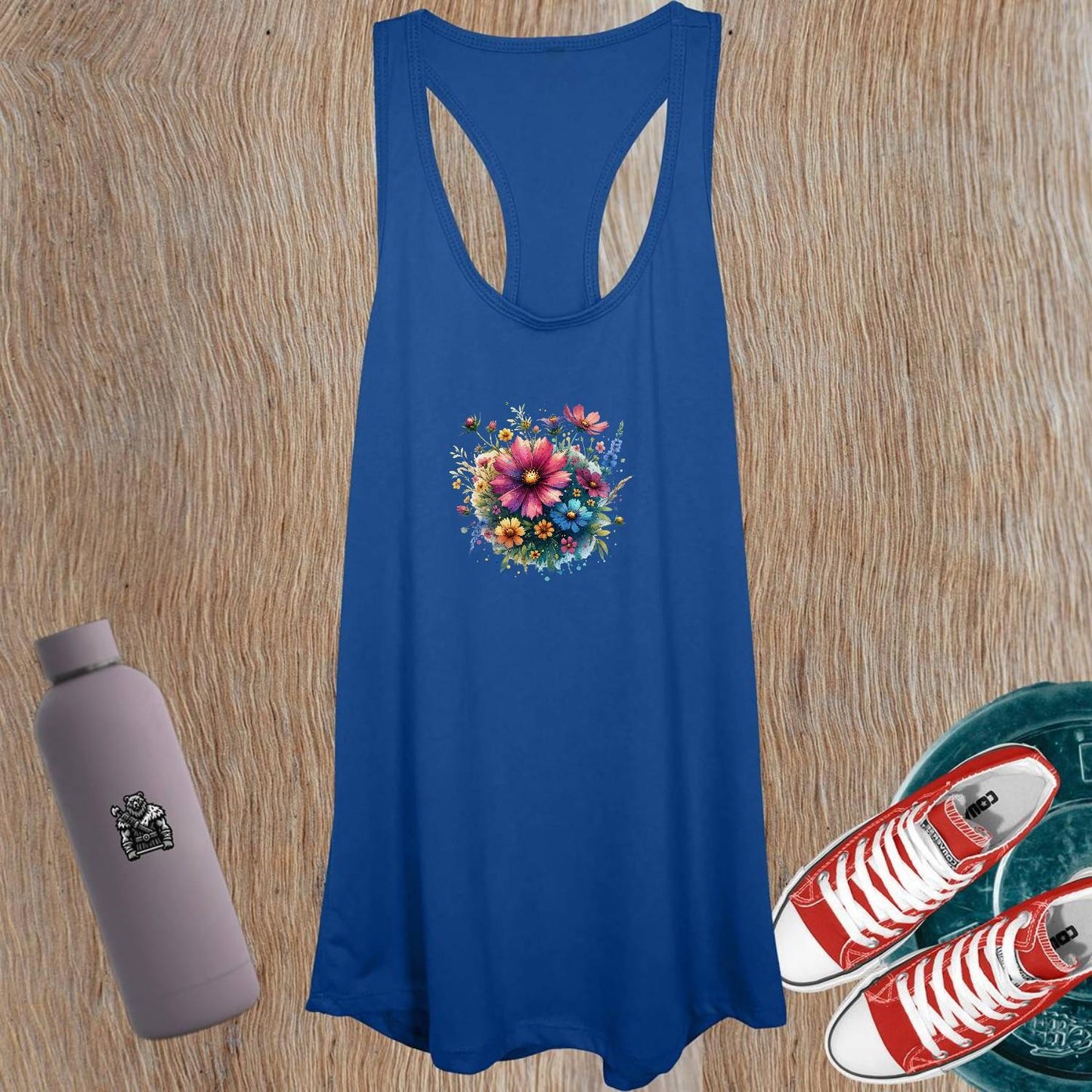 "Vibrant women's floral tank top for workouts, featuring a flattering cut designed for fitness activities like yoga and running."