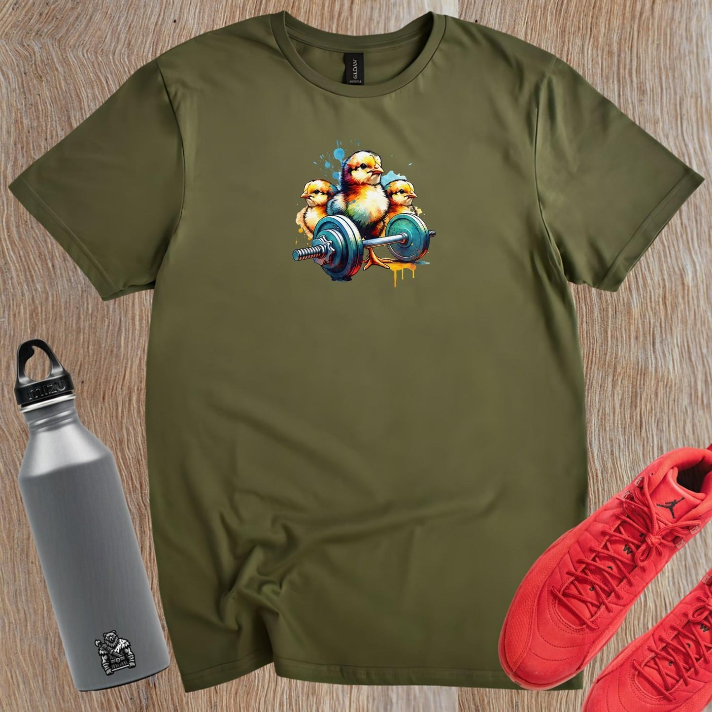 "Vibrant gym T-shirt featuring playful chicks lifting weights, showcasing a fun design for fitness enthusiasts. Perfect for workouts!"
