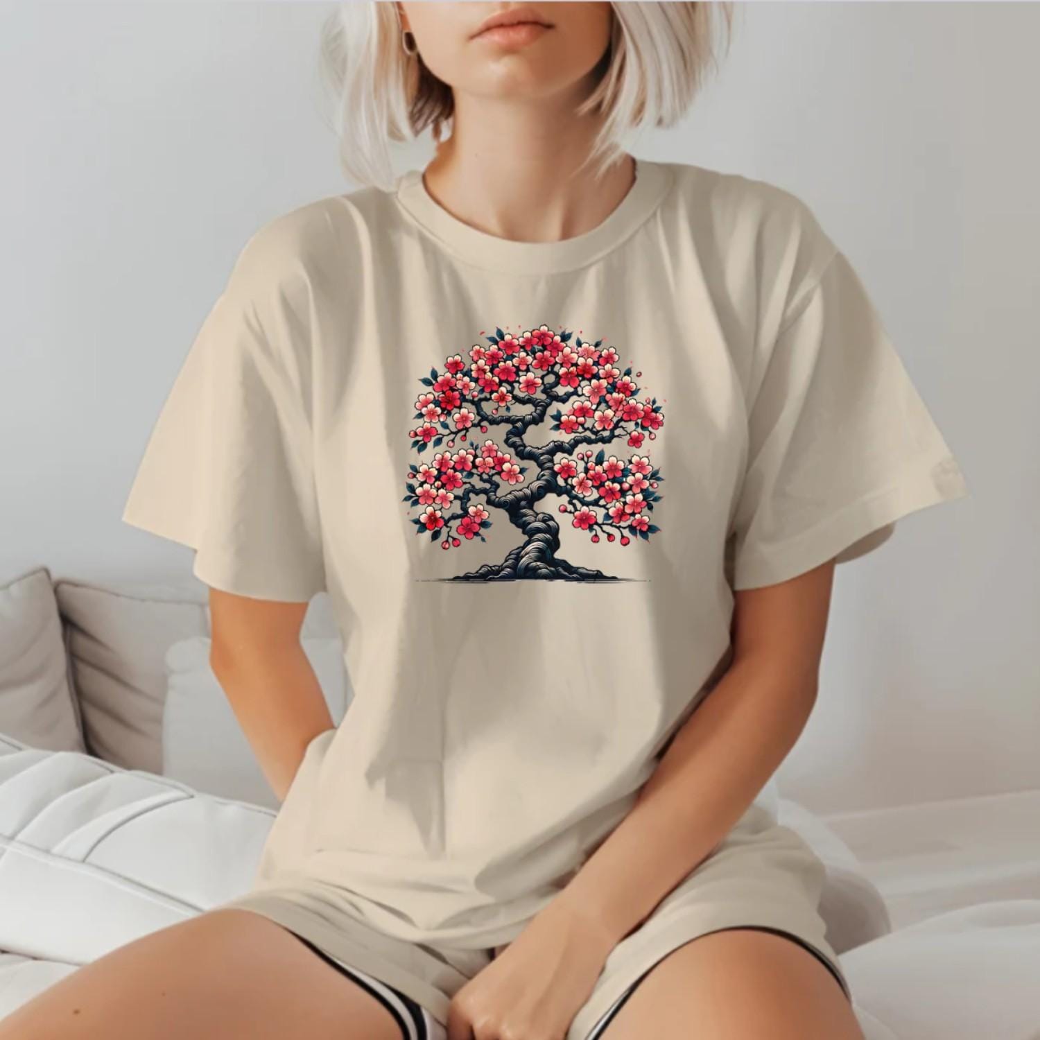 Alt text: "Vibrant cherry blossom tree design on a stylish gym t-shirt, symbolizing strength and resilience for fitness enthusiasts."