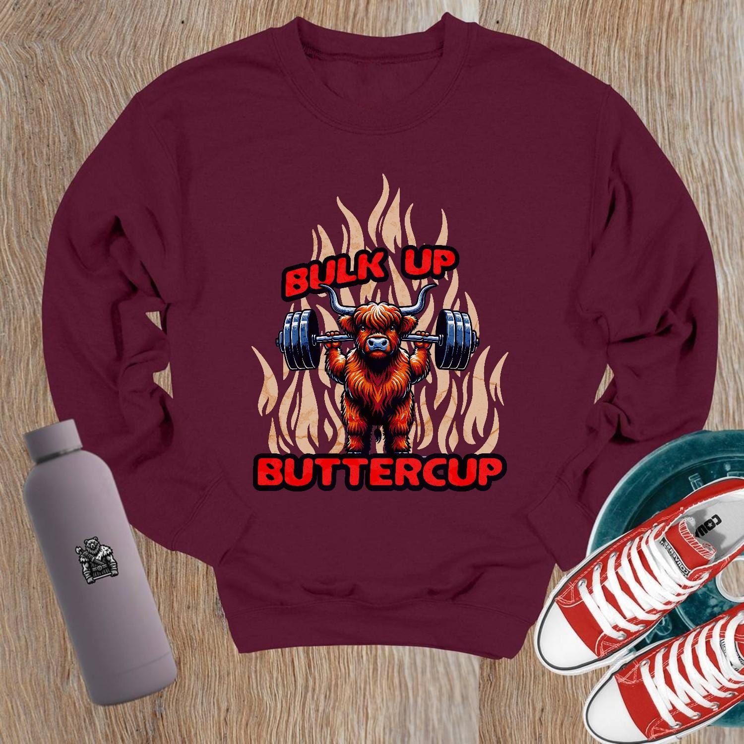 "Graphic crewneck sweatshirt featuring 'Bulk Up Buttercup' design, perfect for gym workouts or casual wear, inspiring fit lifestyle."