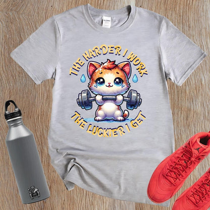 "Vibrant gym T-shirt featuring a determined kitty lifting weights, inspiring fitness enthusiasts with playful motivation for workouts."