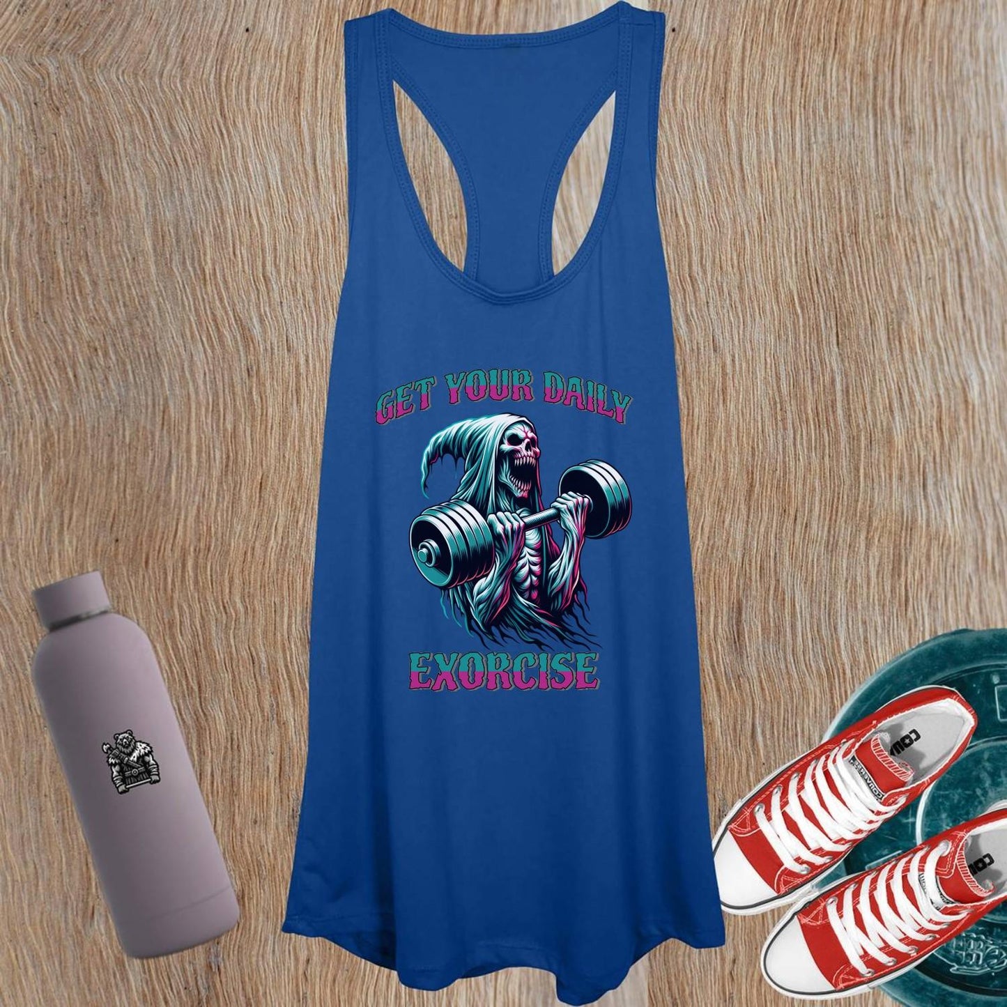 "Women's tank top featuring a bold graphic of a skeletal figure lifting weights, symbolizing strength and motivation for workouts."