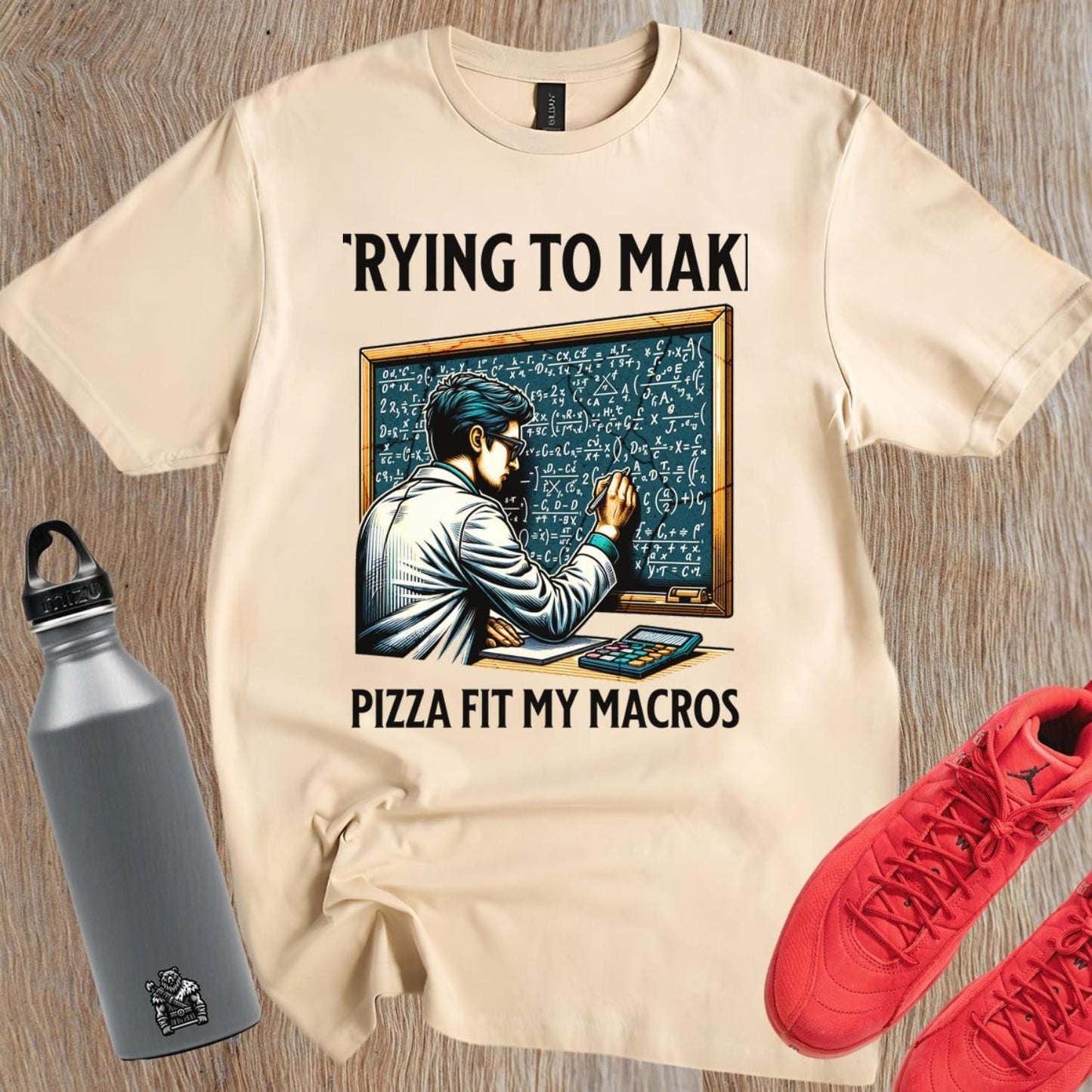 Alt text: "Humorous gym T-shirt design featuring a lab-coated character calculating pizza macros, perfect for fitness enthusiasts who love food."