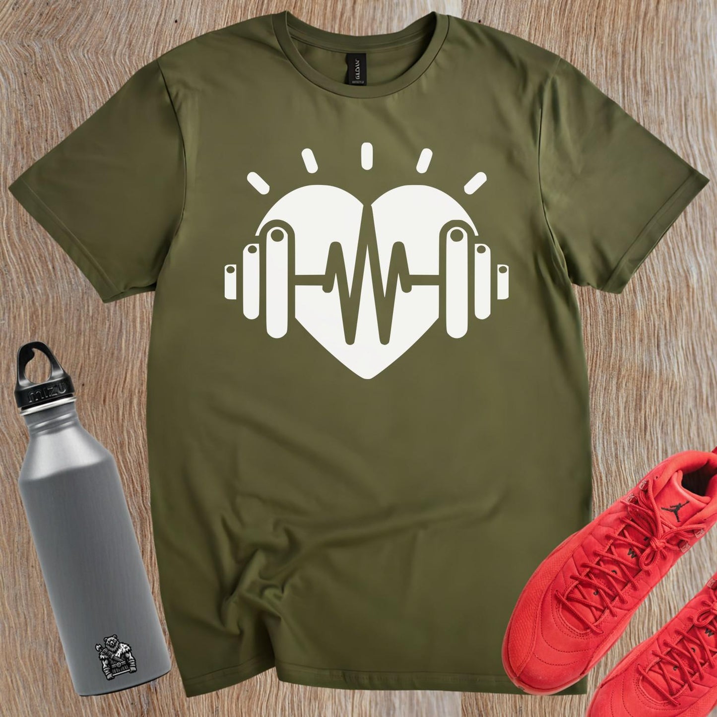 Dynamic gym T-shirt featuring a heart and weights graphic, symbolizing fitness dedication, perfect for workouts and casual wear.