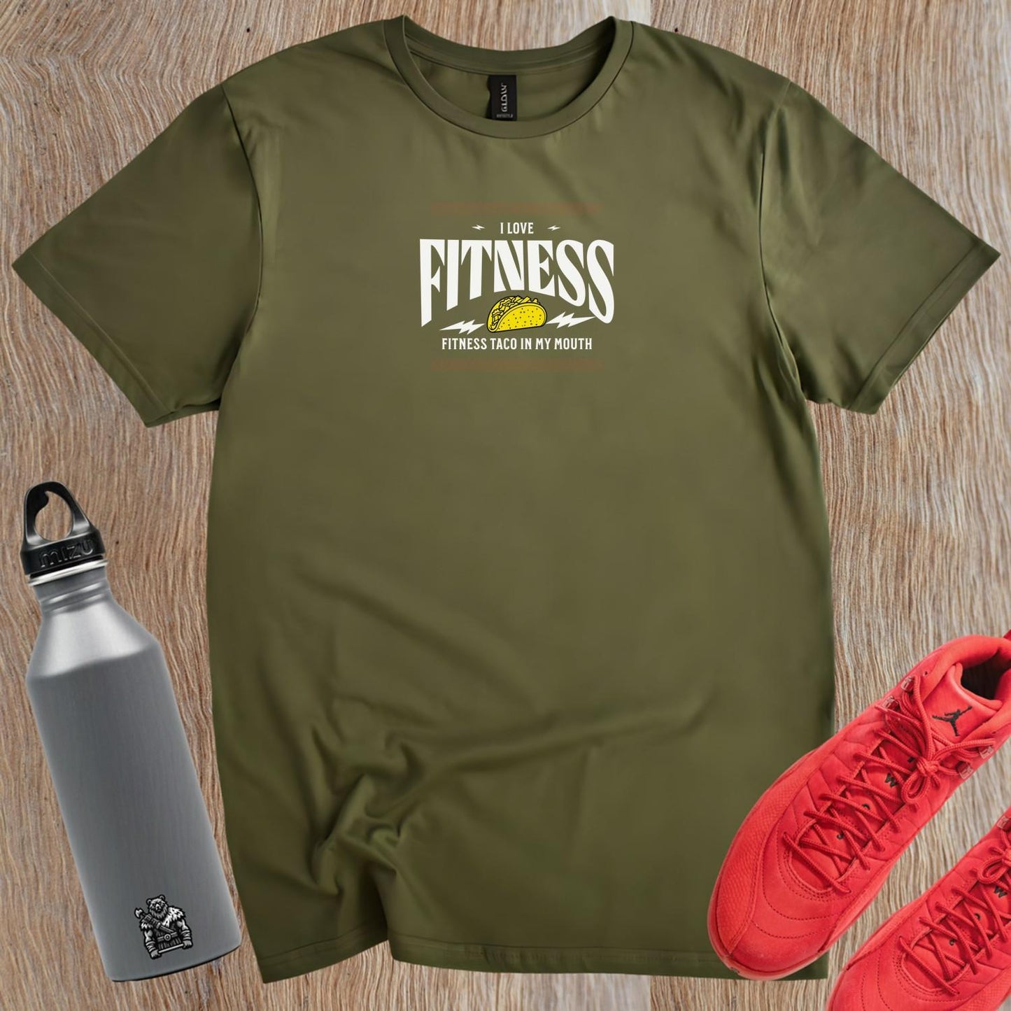 Alt text: Bold graphic gym T-shirt featuring a playful blend of fitness and taco theme, perfect for fitness enthusiasts and conversation starters.