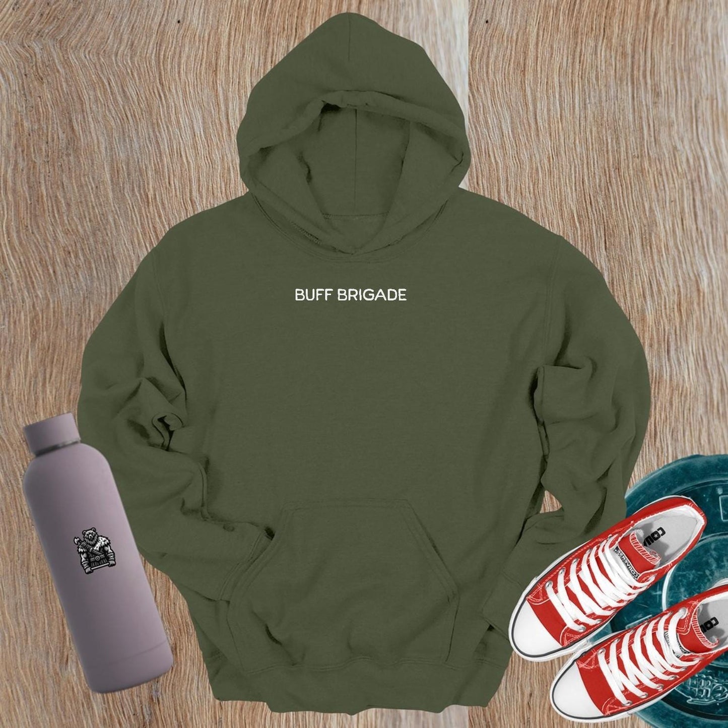 "Graphic gym hoodie featuring bold 'Buff Brigade' design, combining style and comfort for fitness enthusiasts. Ideal for workouts."