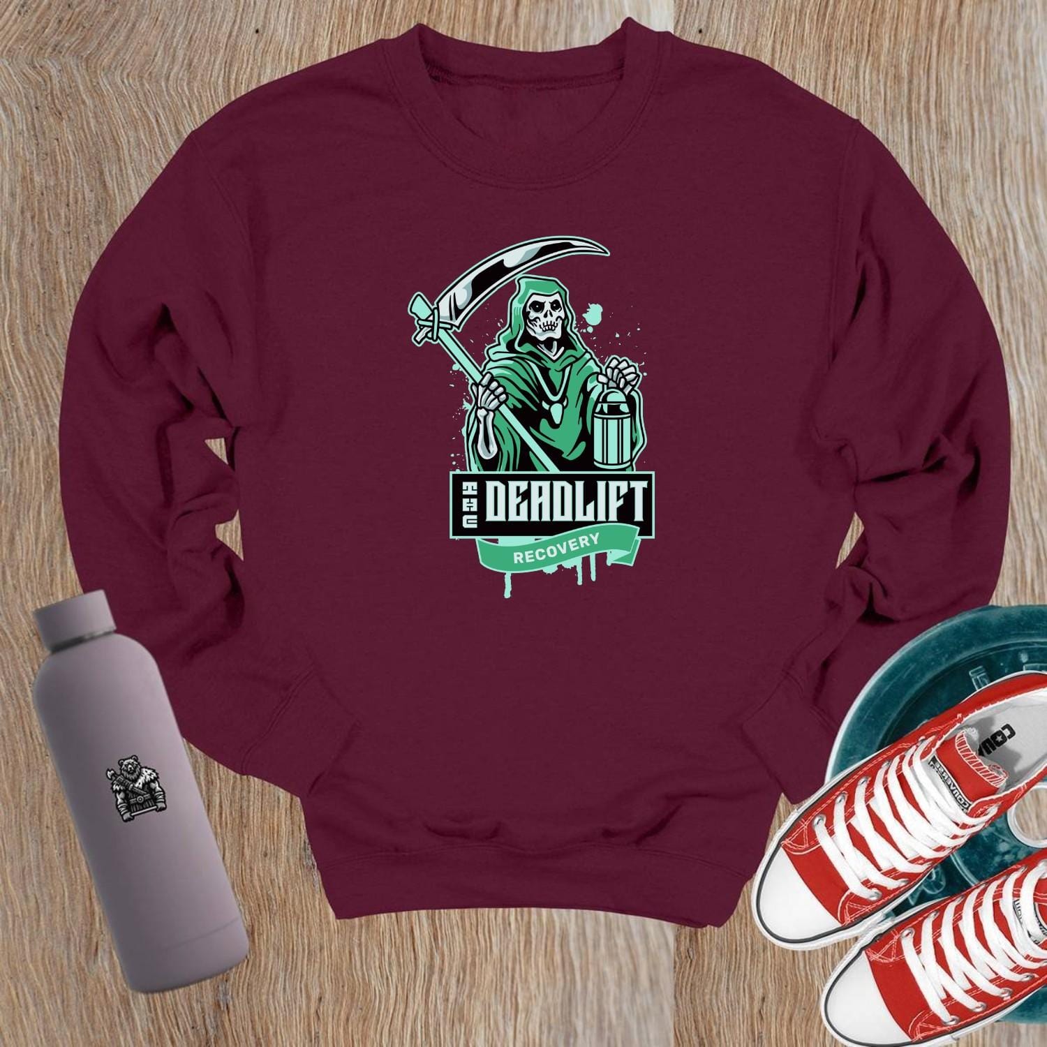 "Edgy black crewneck sweatshirt with 'Deadlift Recovery' graphic, perfect for gym enthusiasts and fitness lovers. Comfortable fit."
