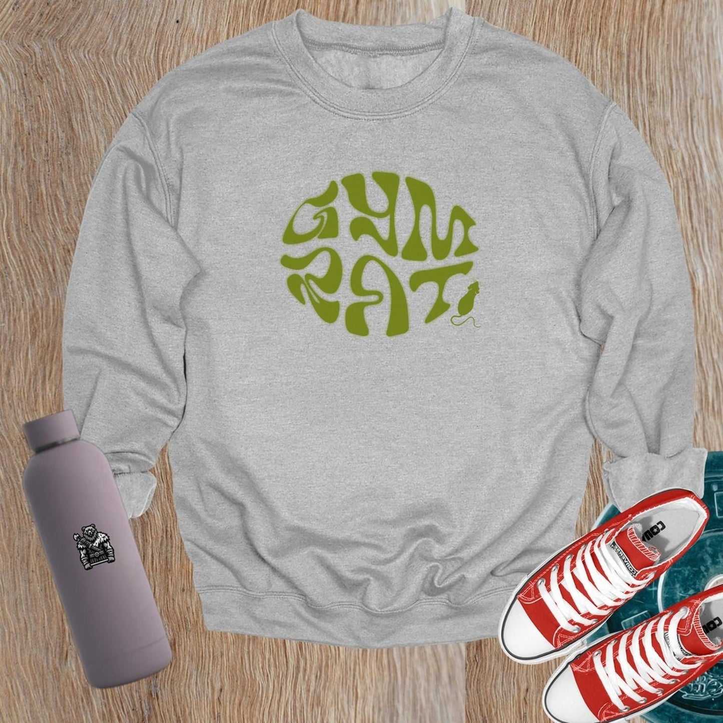 "Graphic gym crewneck sweatshirt featuring bold 'Gym Rat' design, perfect for fitness enthusiasts, blending style and comfort for workouts."