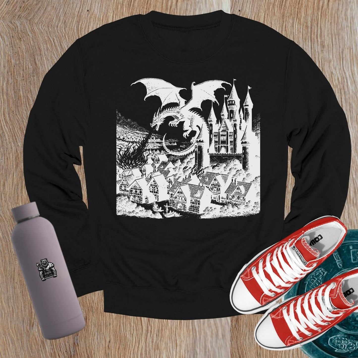 "Image of a vibrant dragon and castle graphic on a crewneck sweatshirt, perfect for gym wear and casual outings. Elevate your style!"