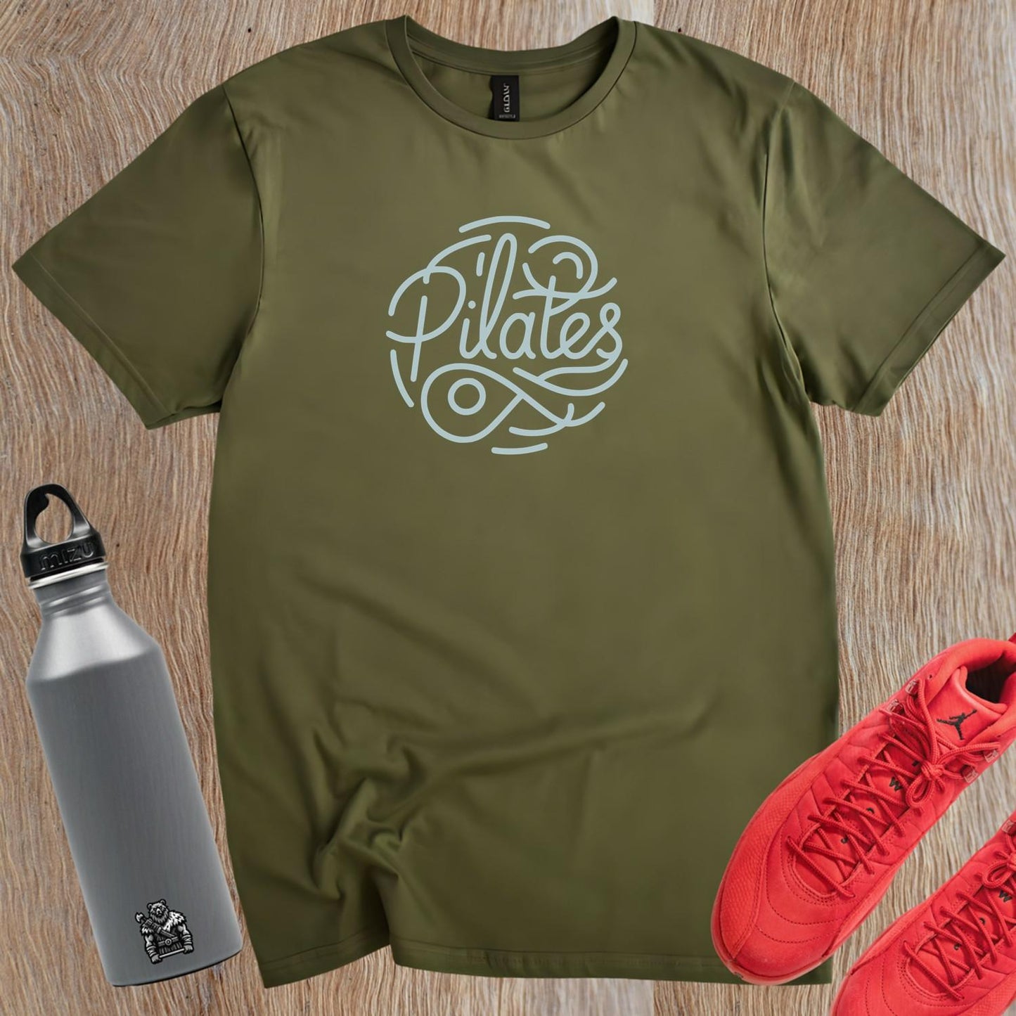 "Stylish Pilates T-shirt featuring an eye-catching graphic, perfect for fitness enthusiasts, combining comfort and motivation for workouts."