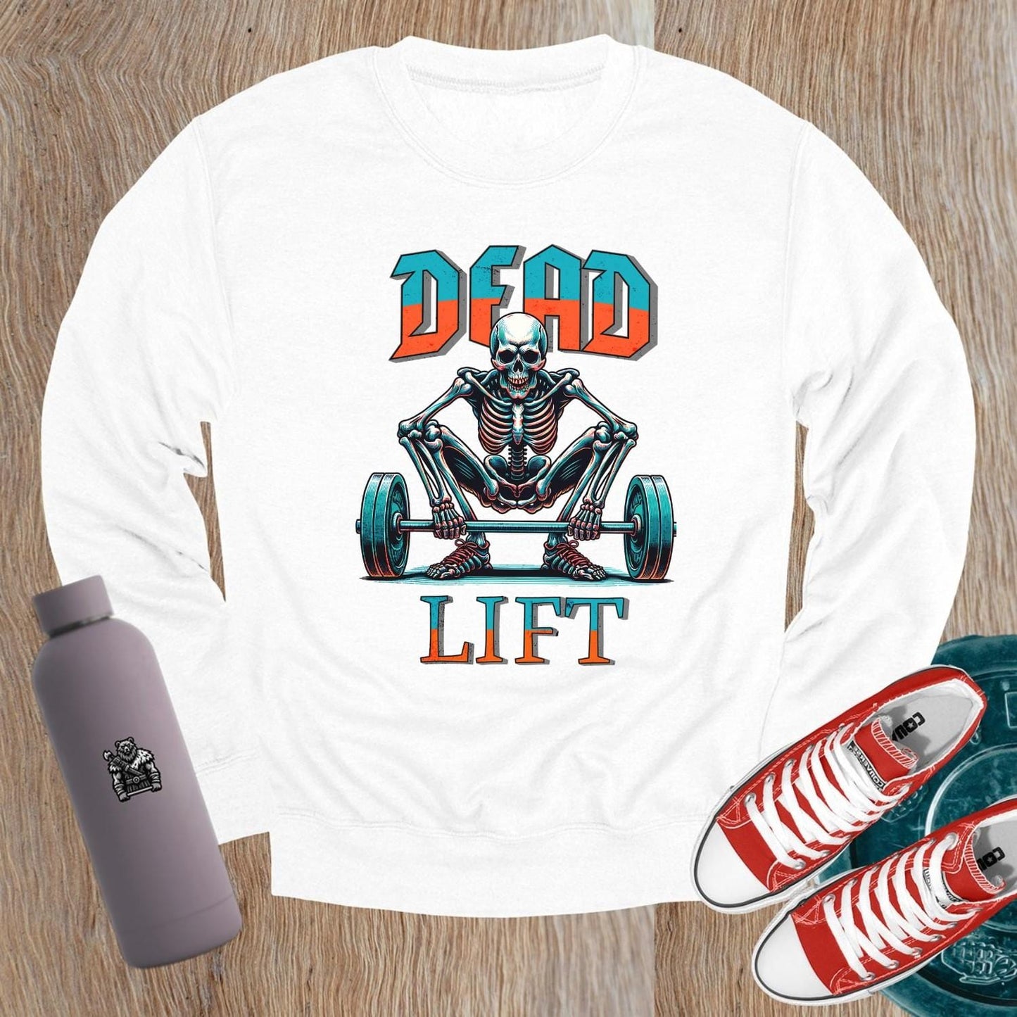 "Edgy 'Dead Lift' sweatshirt featuring a bold skeleton graphic, perfect for gym workouts and casual wear, showcasing strength and style."