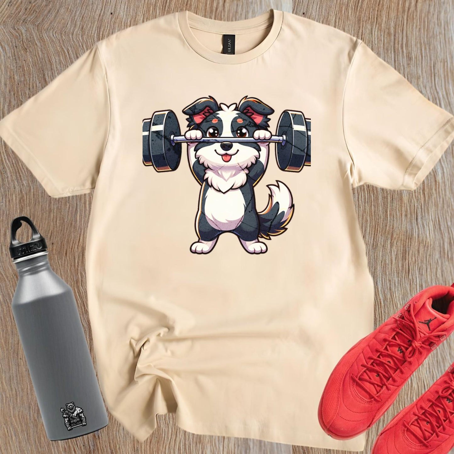 "Playful gym T-shirt featuring a cute lifting puppy graphic, ideal for fitness enthusiasts. Fun design for workouts and casual wear."