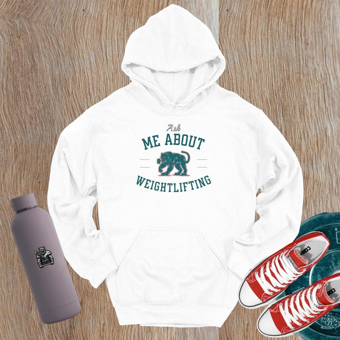 Alt text: "Bold black hoodie with 'Ask Me About Weightlifting' text and vibrant panther graphic, perfect for fitness enthusiasts at the gym."