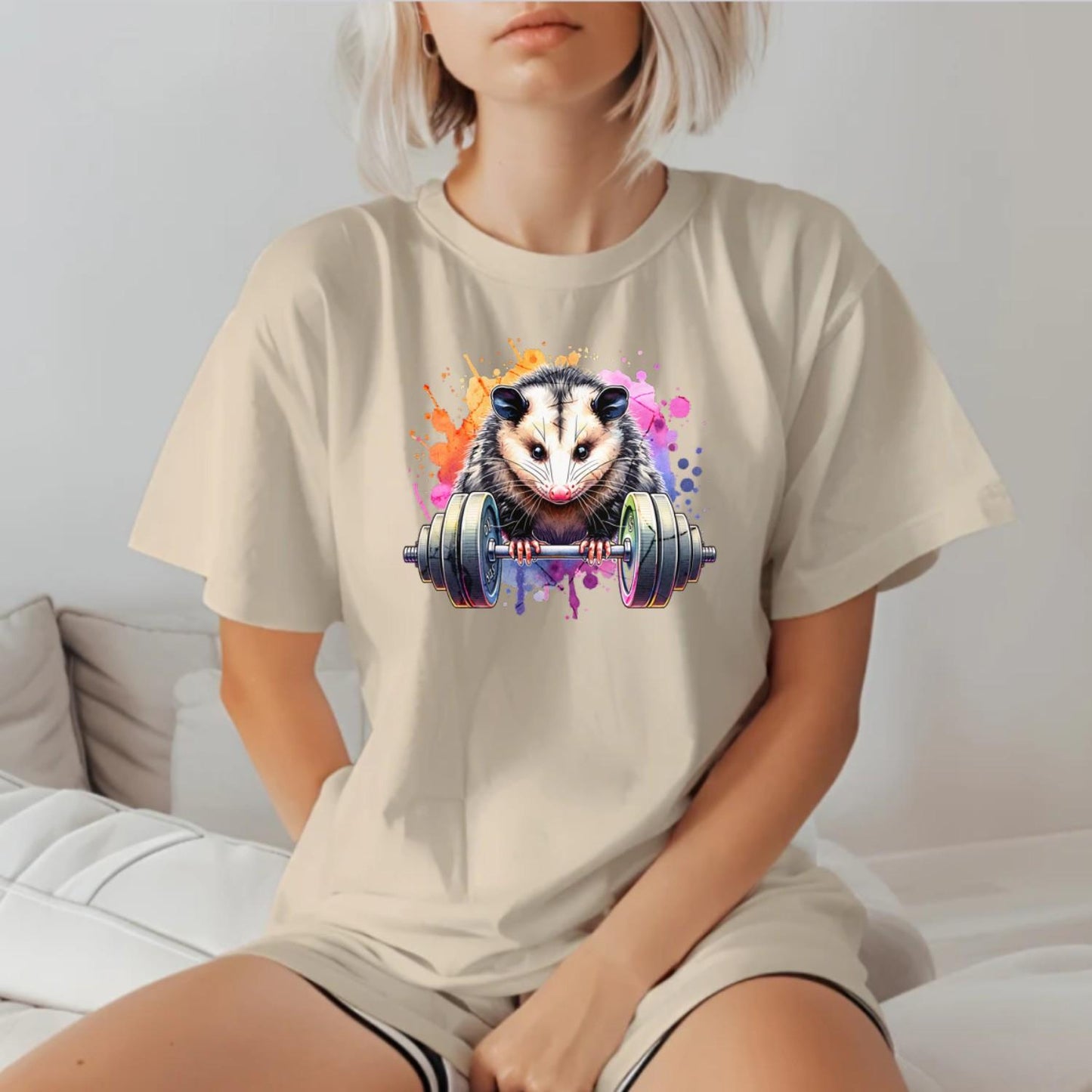 "Vibrant gym T-shirt featuring a fierce possum lifting weights, embodying strength and determination for fitness enthusiasts."