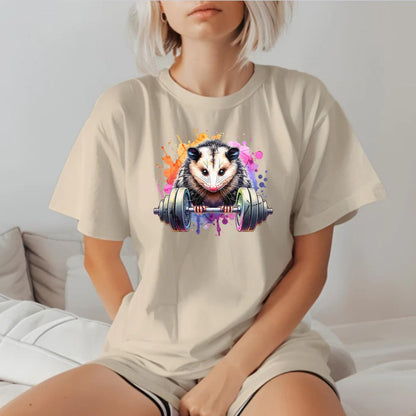 "Vibrant gym T-shirt featuring a fierce possum lifting weights, embodying strength and determination for fitness enthusiasts."