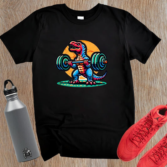 "Colorful gym T-shirt featuring a cartoon dinosaur lifting weights, perfect for fitness lovers seeking motivation and fun in workouts."