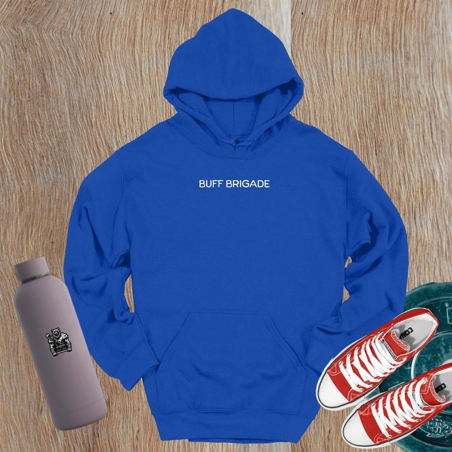 "Graphic gym hoodie featuring bold 'Buff Brigade' design, combining style and comfort for fitness enthusiasts. Ideal for workouts."