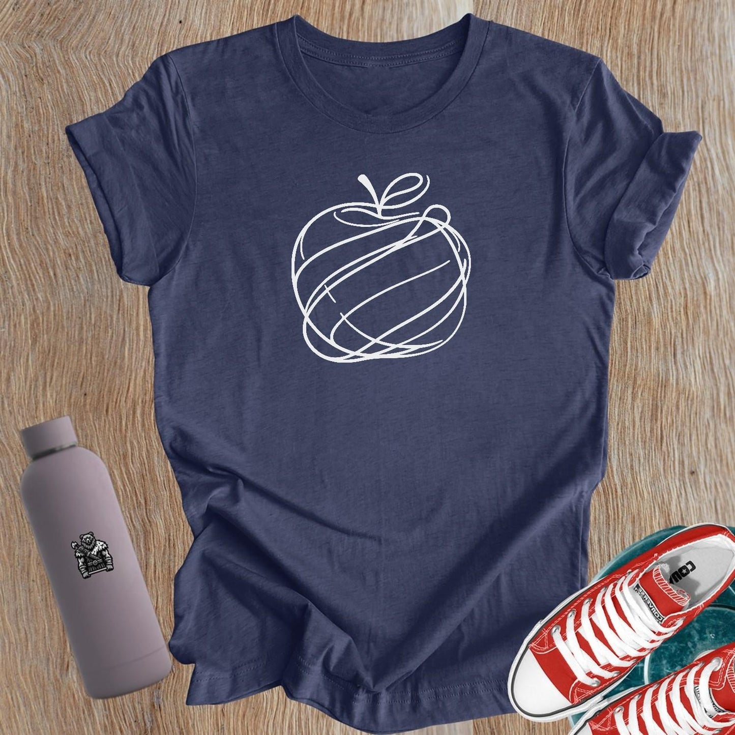 Alt text: "Women's gym T-shirt featuring a chic apple graphic, symbolizing strength and health, perfect for fitness enthusiasts and casual wear."