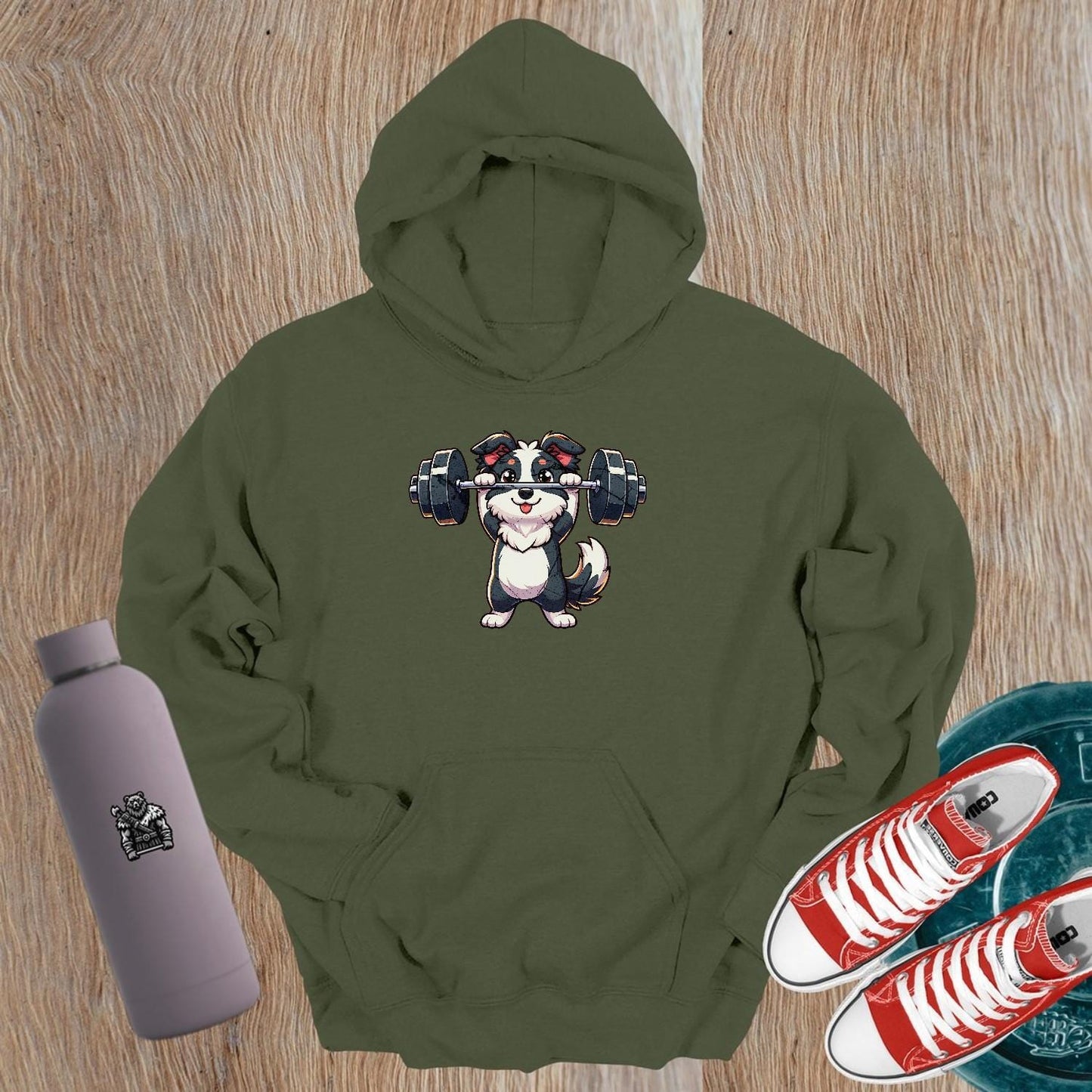 "Playful gym hoodie featuring an adorable weightlifting puppy design, perfect for fitness enthusiasts. Cozy and stylish activewear essential."