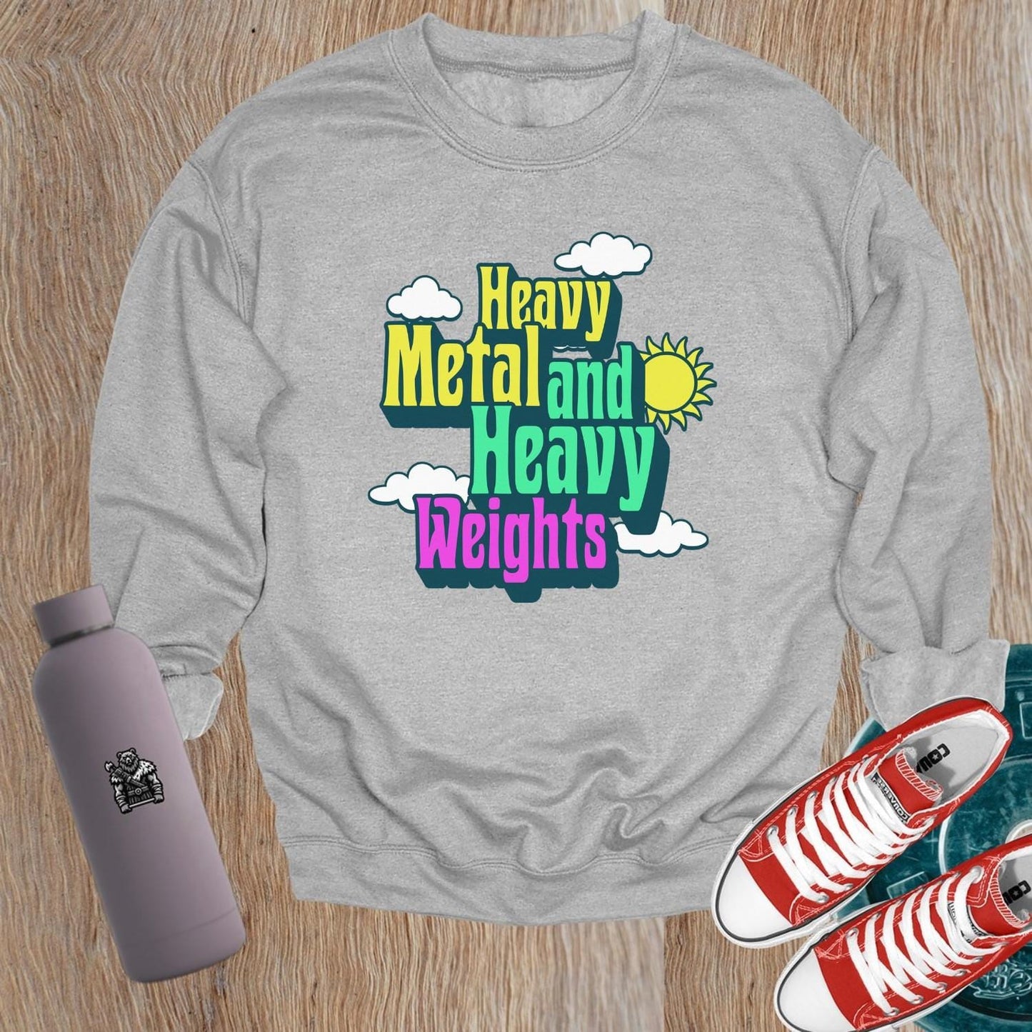 "Vibrant 'Heavy Metal and Heavy Weights' sweatshirt featuring bold graphics, perfect for gym enthusiasts and music lovers, ideal for workouts."