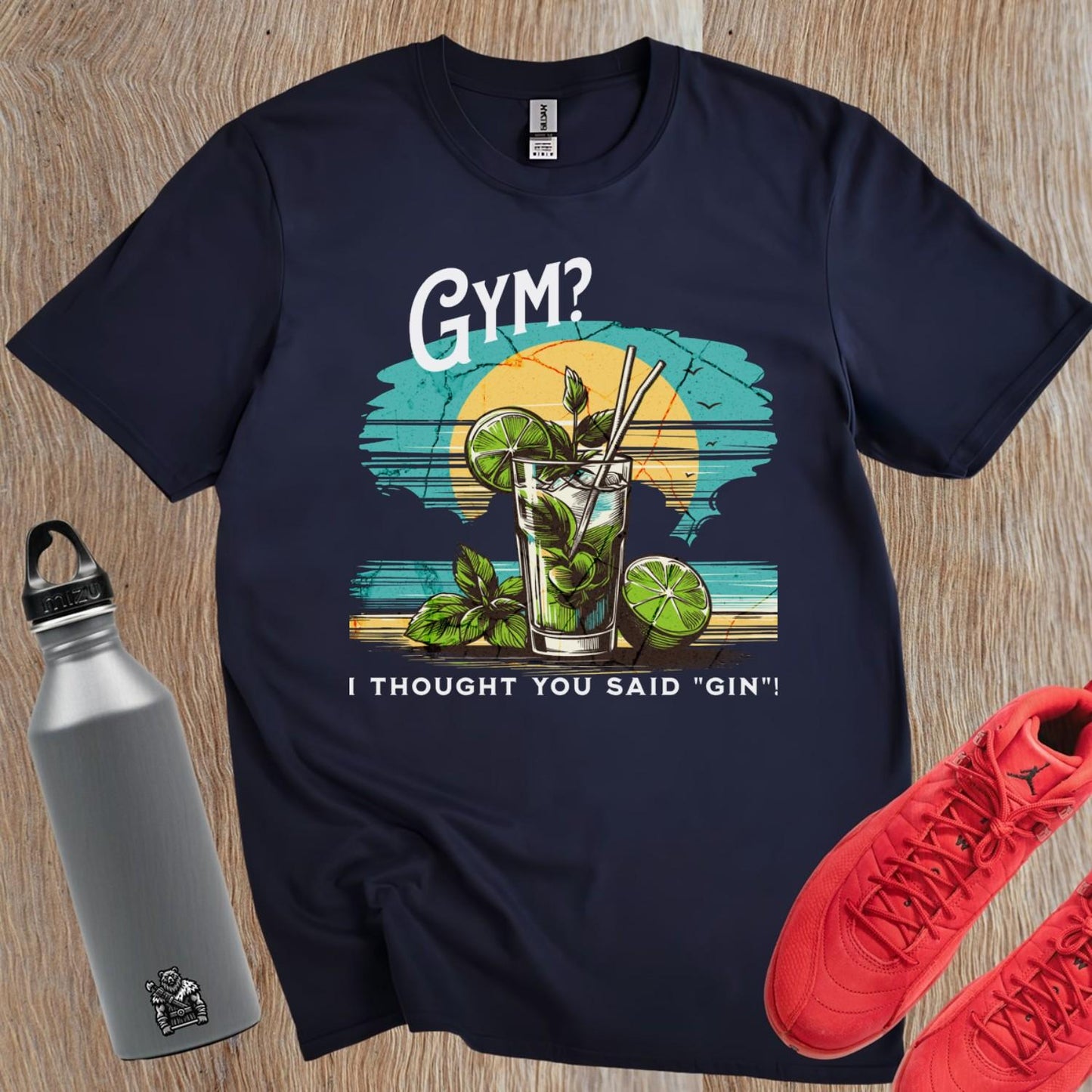 "Vibrant gym T-shirt featuring a colorful cocktail design with the playful phrase 'I thought you said “gin”!' Ideal for fitness lovers."