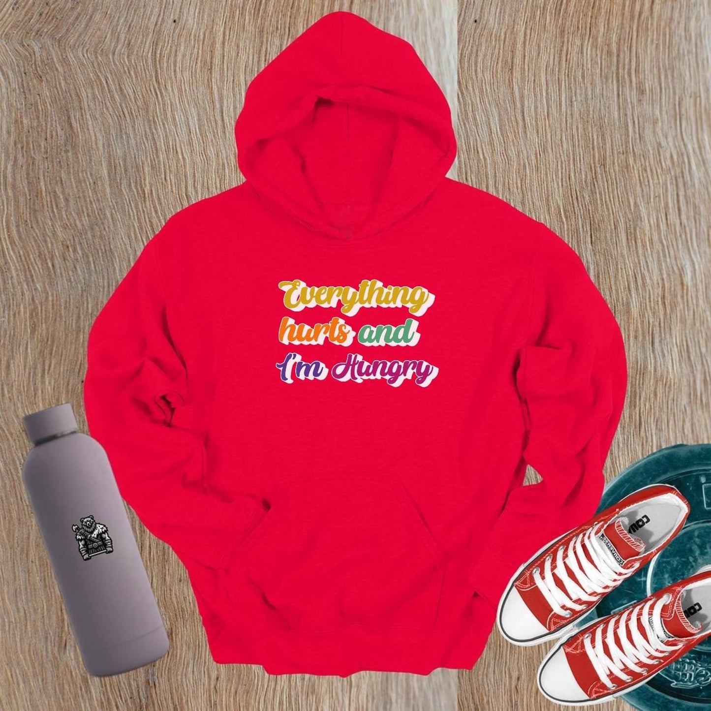 "Vibrant gym hoodie featuring the mantra 'Everything hurts and I'm Hungry,' perfect for workouts and post-gym outings, combining style, comfort, and motivation."