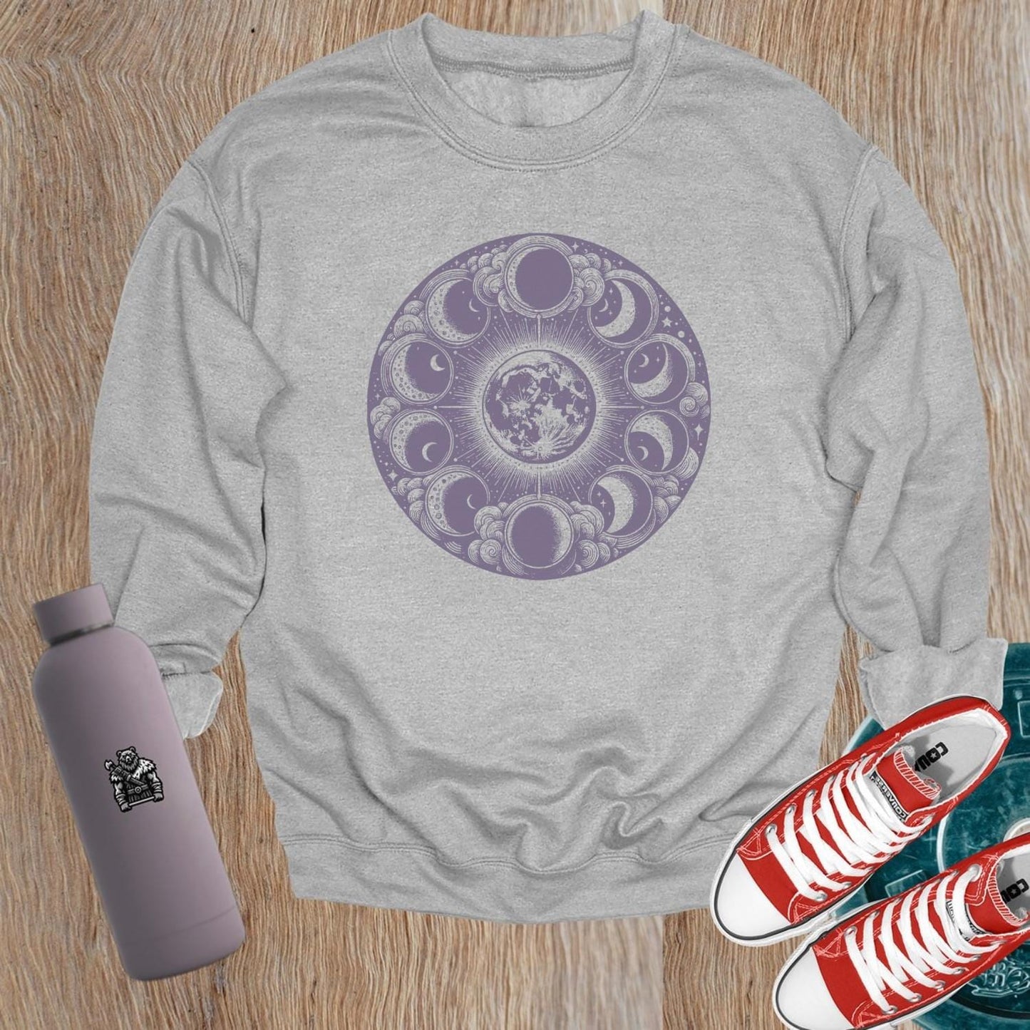 "Moon Phase Sweatshirt showcasing a celestial design with moon phases, perfect for gym workouts and yoga, blending style and comfort."