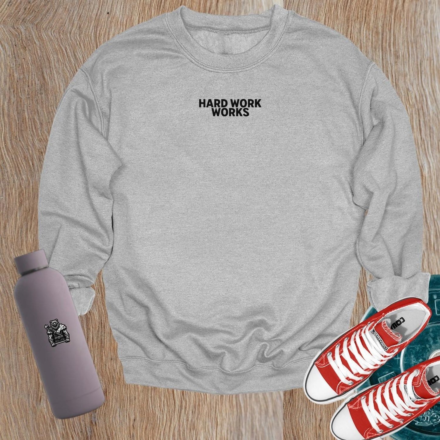 "Hard Work Works gym sweatshirt featuring a motivational graphic, perfect for layering pre- or post-workout, blending style and comfort."