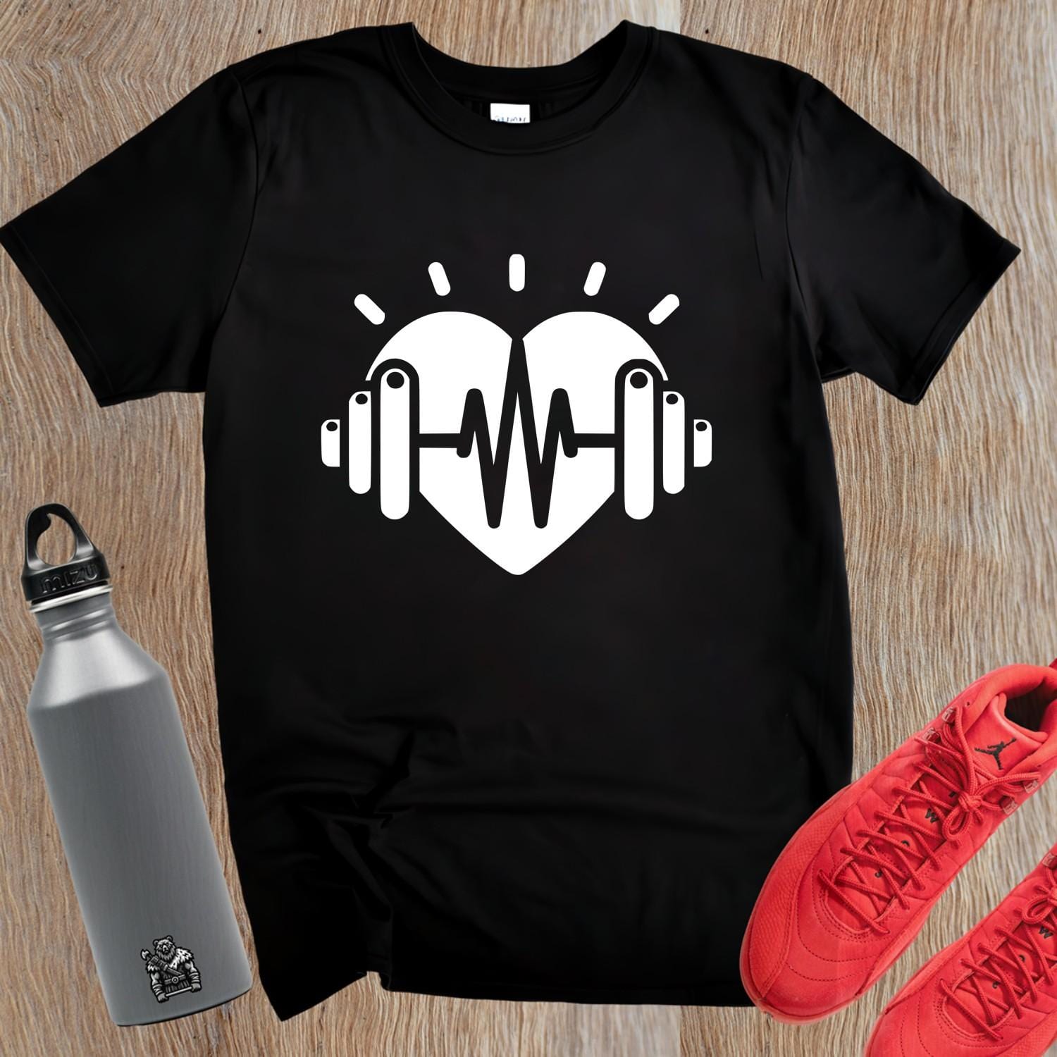 Dynamic gym T-shirt featuring a heart and weights graphic, symbolizing fitness dedication, perfect for workouts and casual wear.