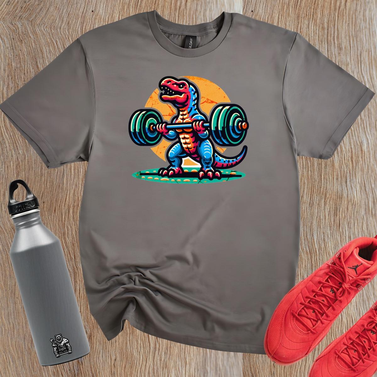 "Colorful gym T-shirt featuring a cartoon dinosaur lifting weights, perfect for fitness lovers seeking motivation and fun in workouts."