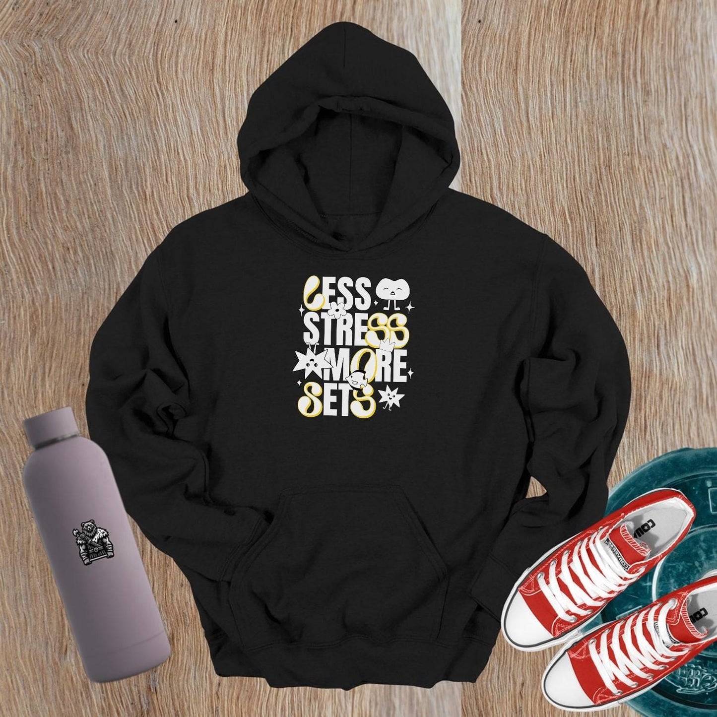 Vibrant gym hoodie featuring "Less Stress, More Sets!" motivational mantra, perfect for workouts and casual wear, embracing fitness fun.